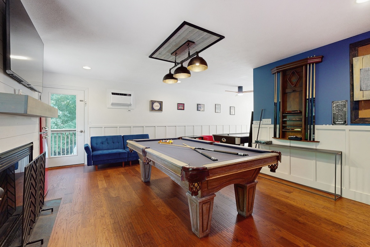 A pool table in a game room