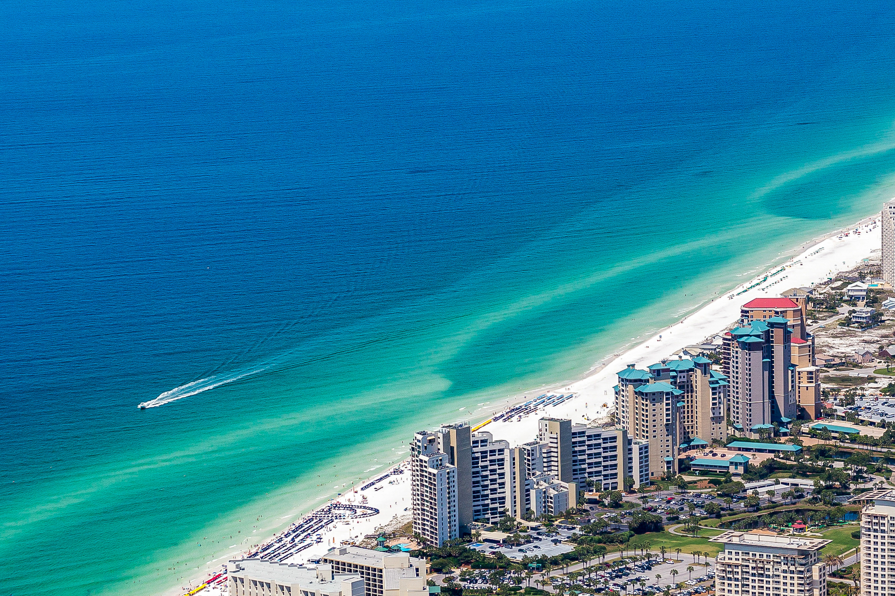 aerial view of Miramar Beach, FL with boat in the ocean