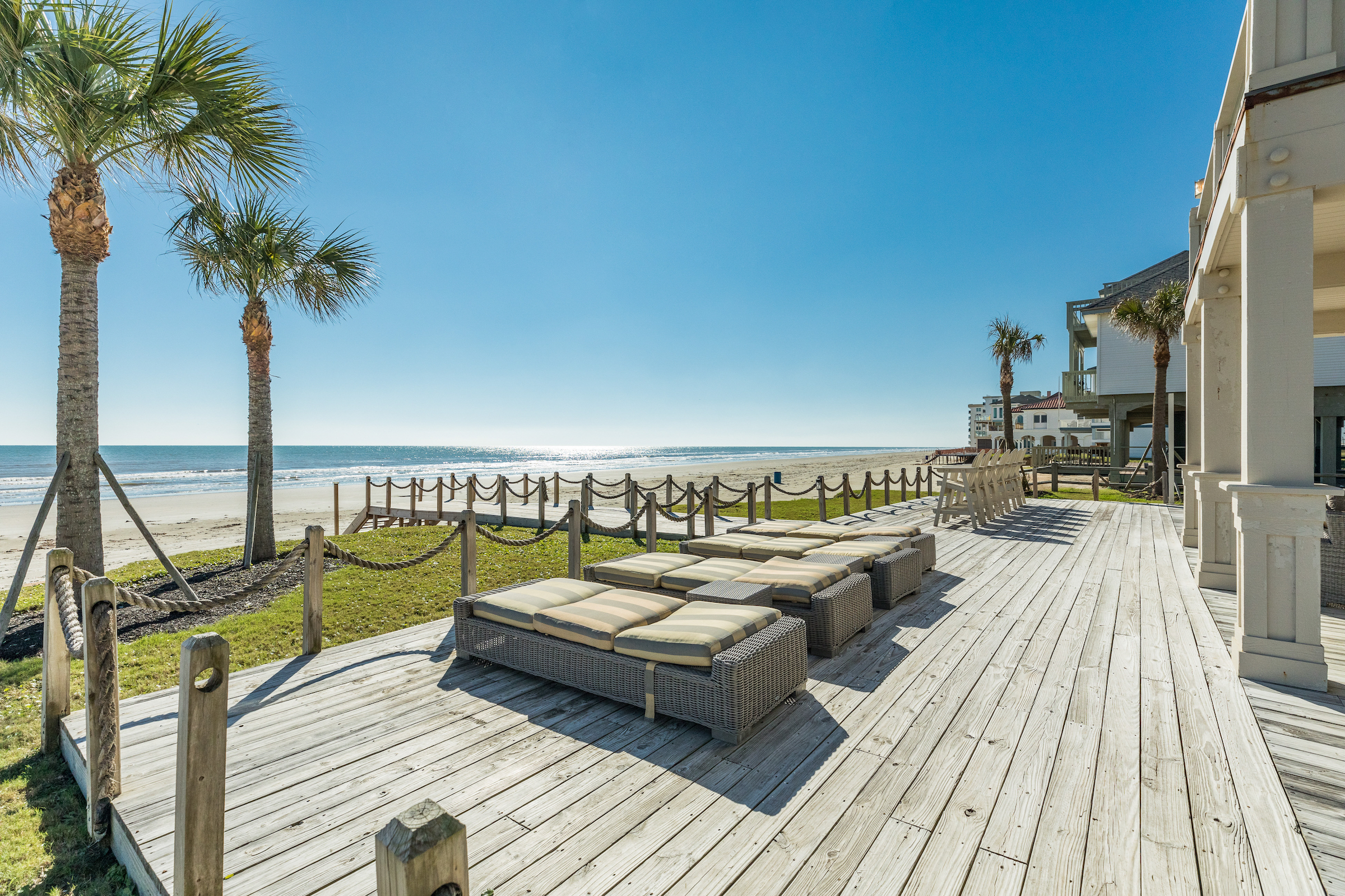 Lounge chairs sit on deck of gulf-front resort in Galveston, TX