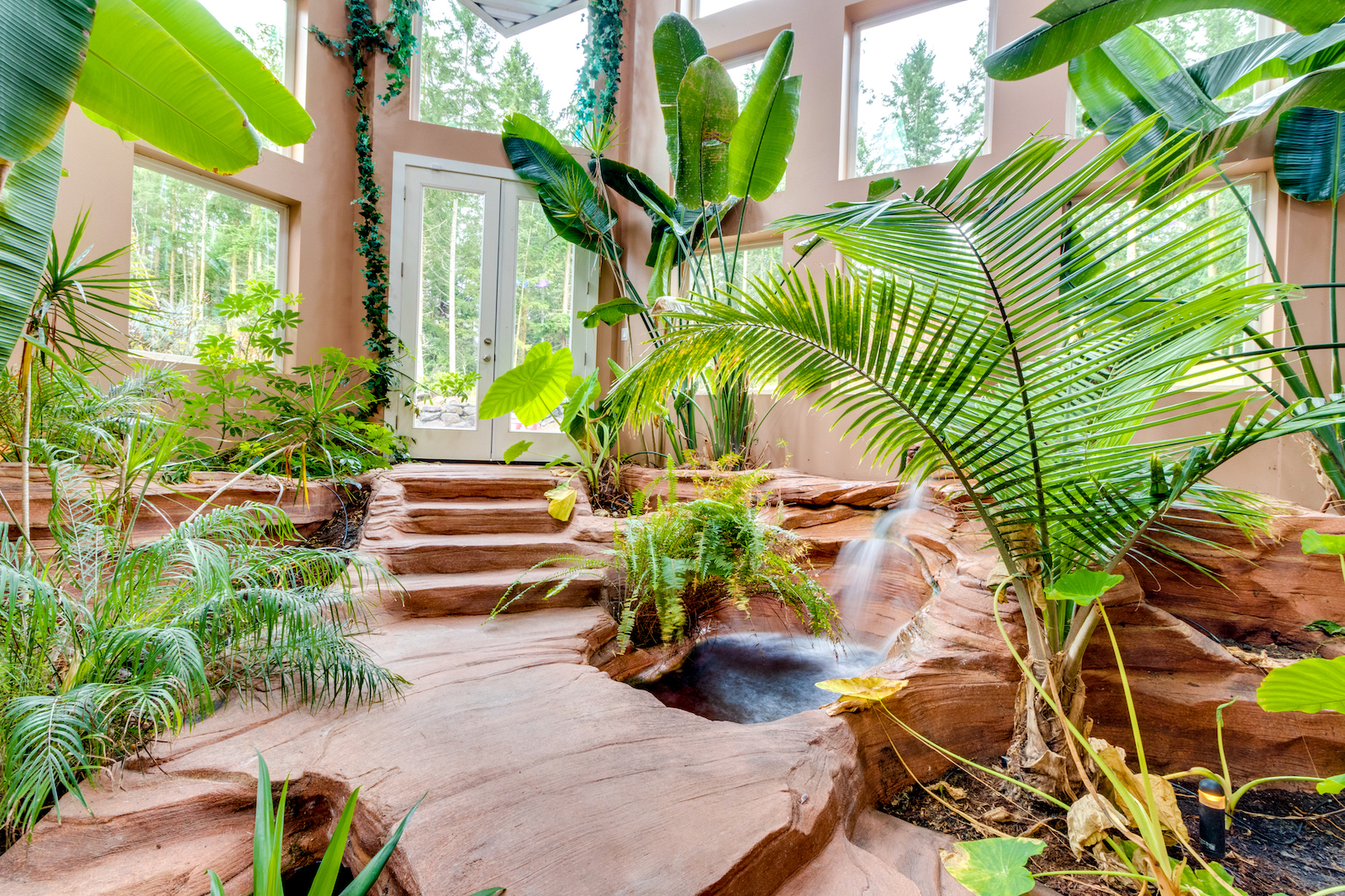An interior garden with a hot tub at a vacation rental in Sequim, WA.