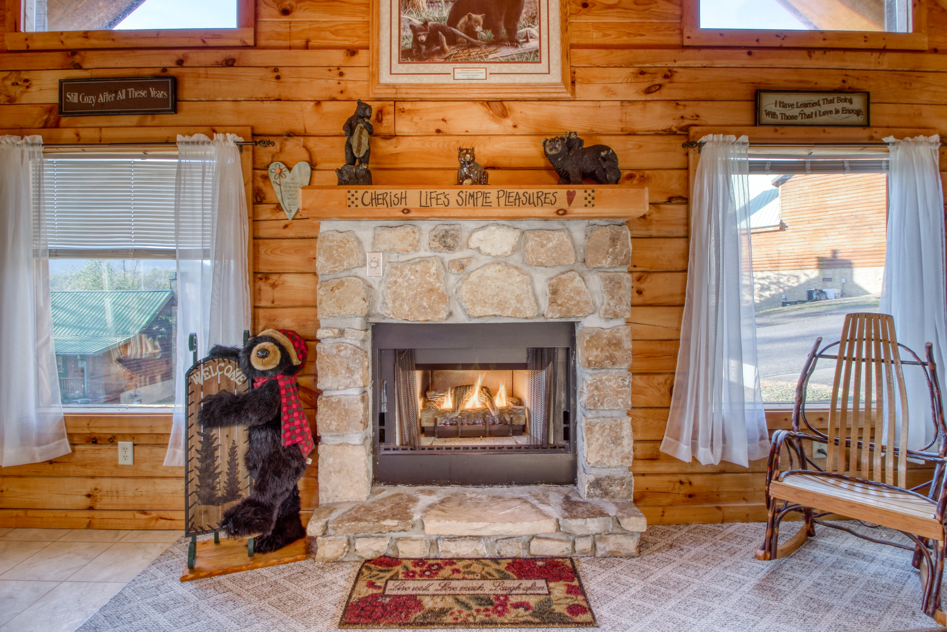 Fireplace with bear decorations in a cabin in Pigeon Forge, TN.