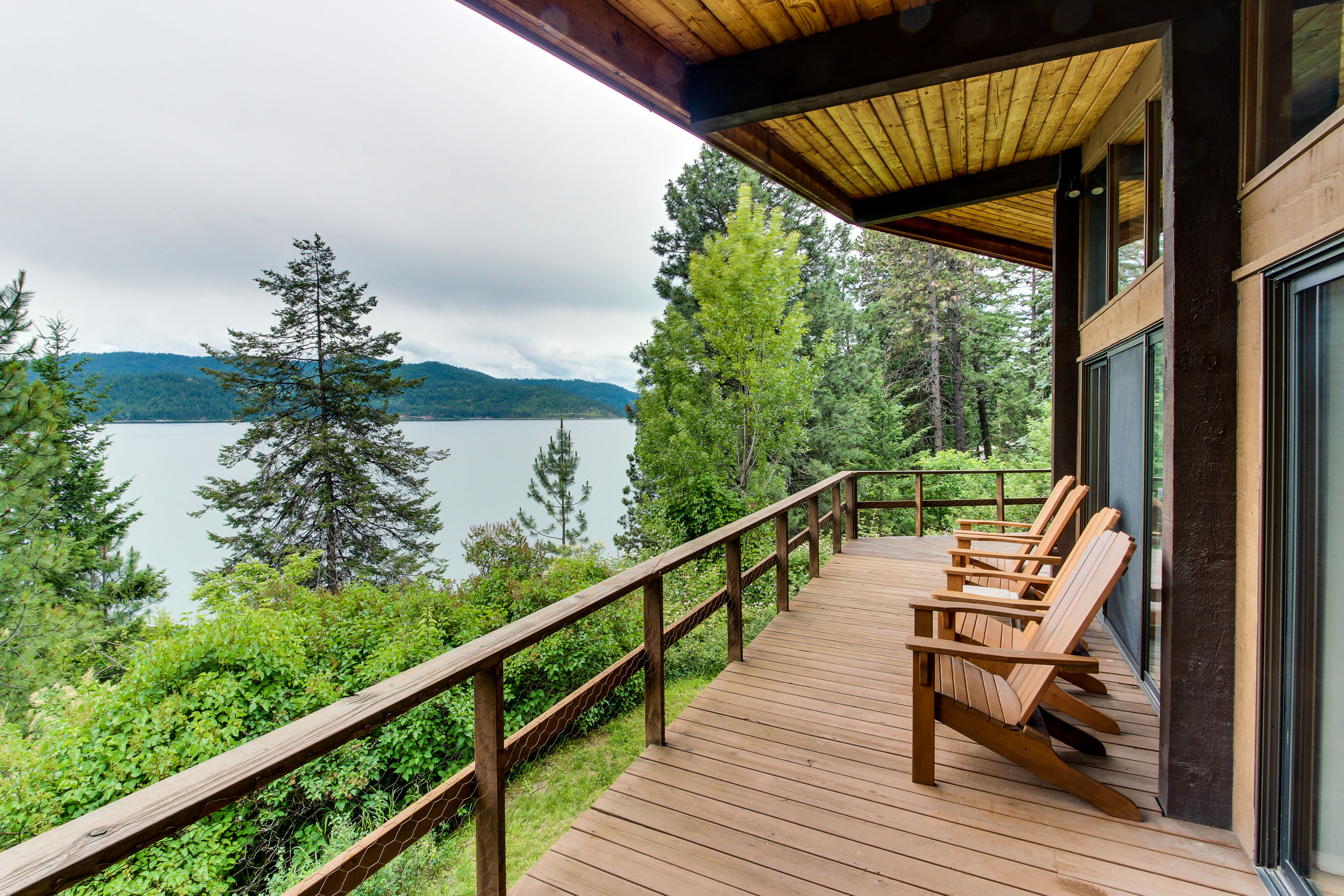 adirondack chairs face the water at Idaho cabin