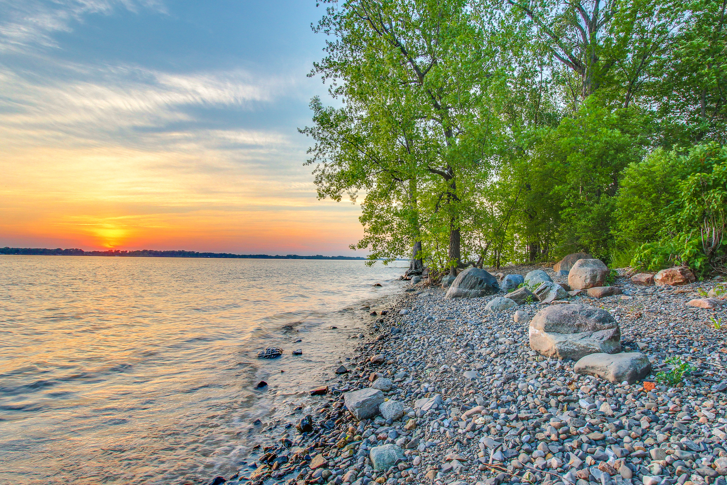 Rocky shores of Lake Champlain, VT during a sunset