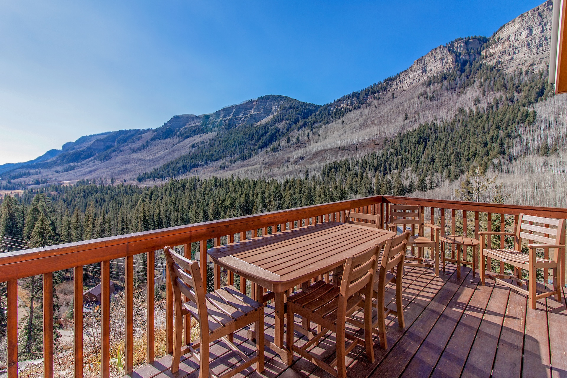 View over woods of the rolling mountains as seen from the deck at a vacation rental in Durango, CO.