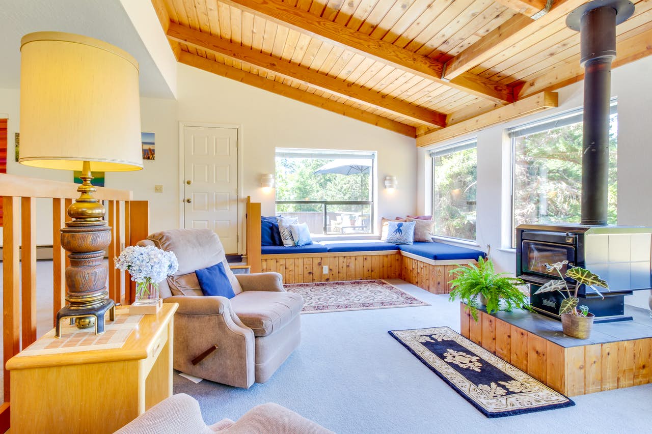 adorable wood accented living space with wood-burning fireplace in Sea Ranch, CA