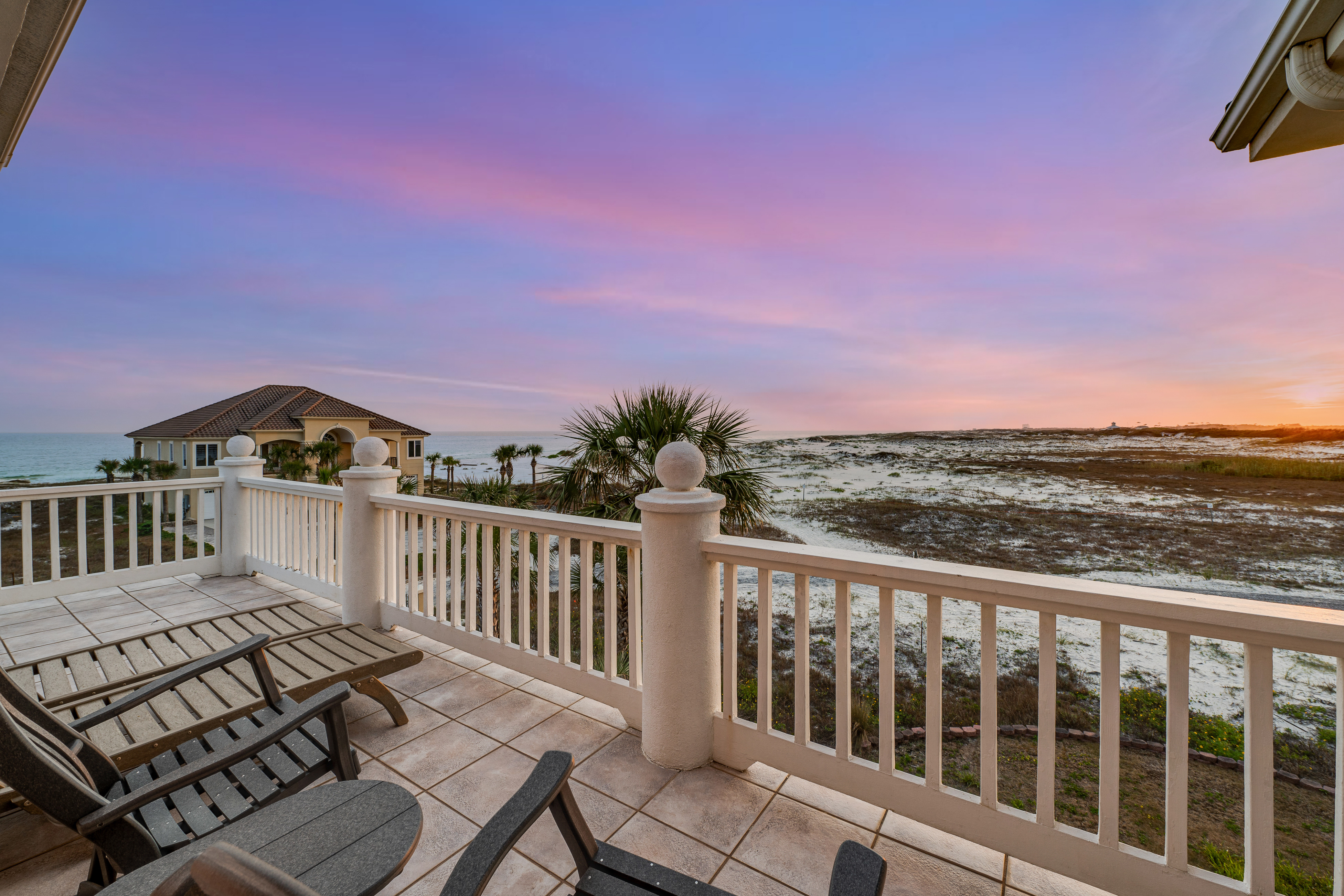 The deck of a vacation rental overlooking the beach in Gulf Shores.