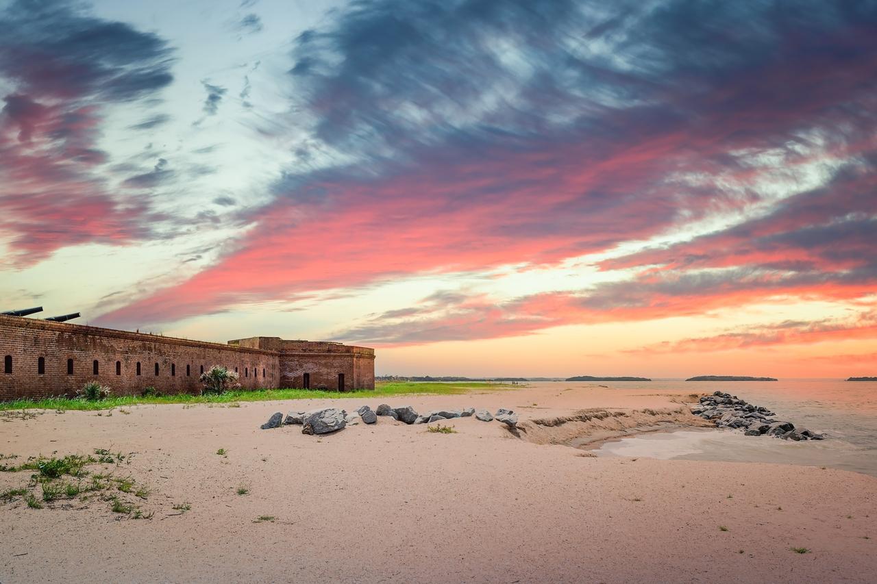 historic building on the shores of amelia island at sunset