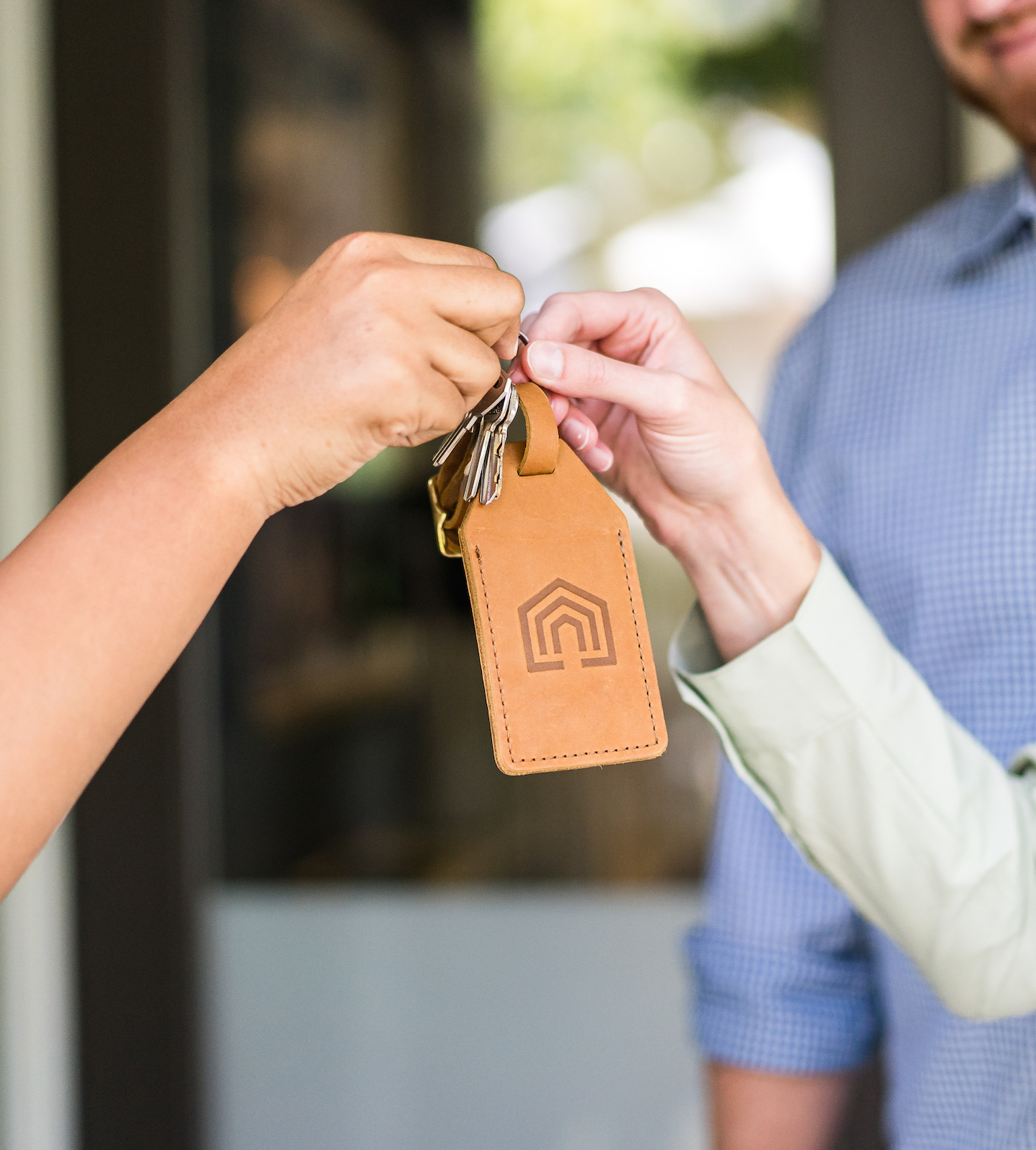 The hands of two vacation rental owners working with Vacasa.