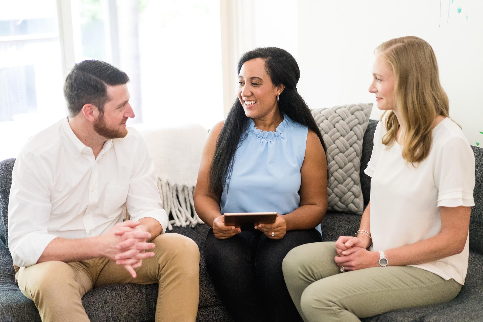 One man and two women going over tax information for a vacation rental.