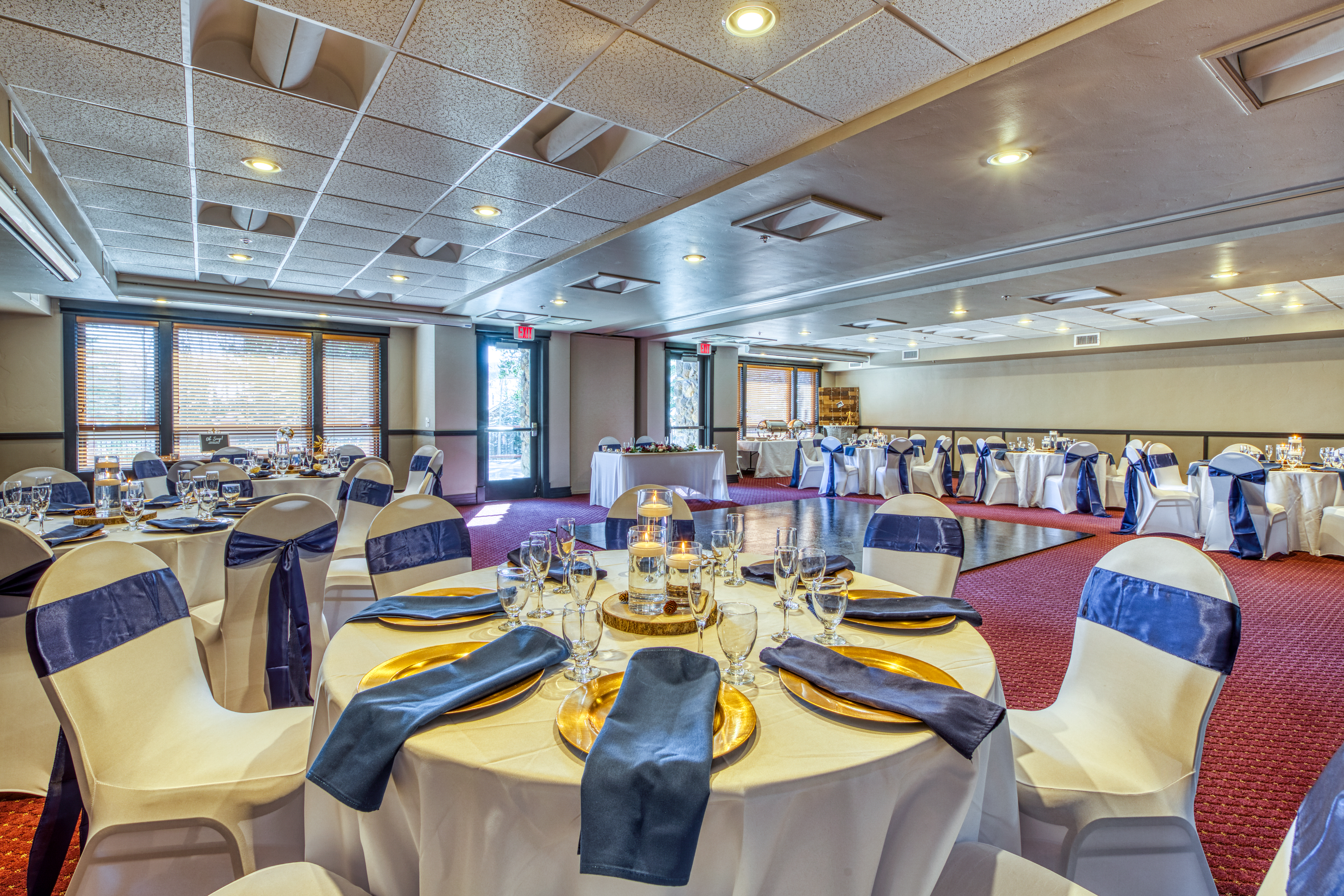 BlueSky Breckenridge ballroom with arranged tables and dance floor.