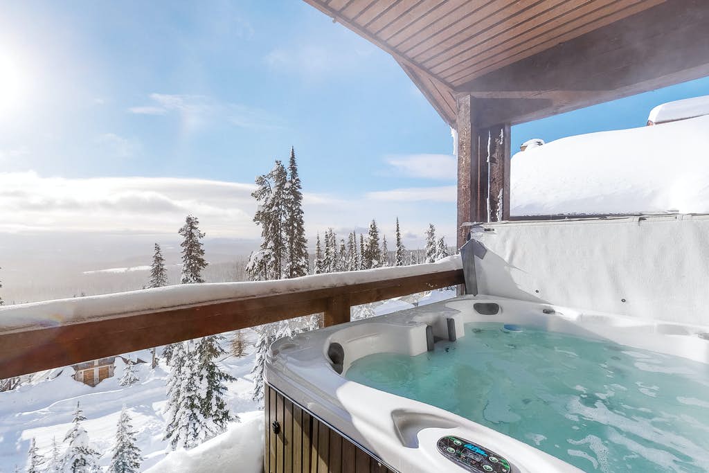 private hot tub on balcony with mountain views in british columbia