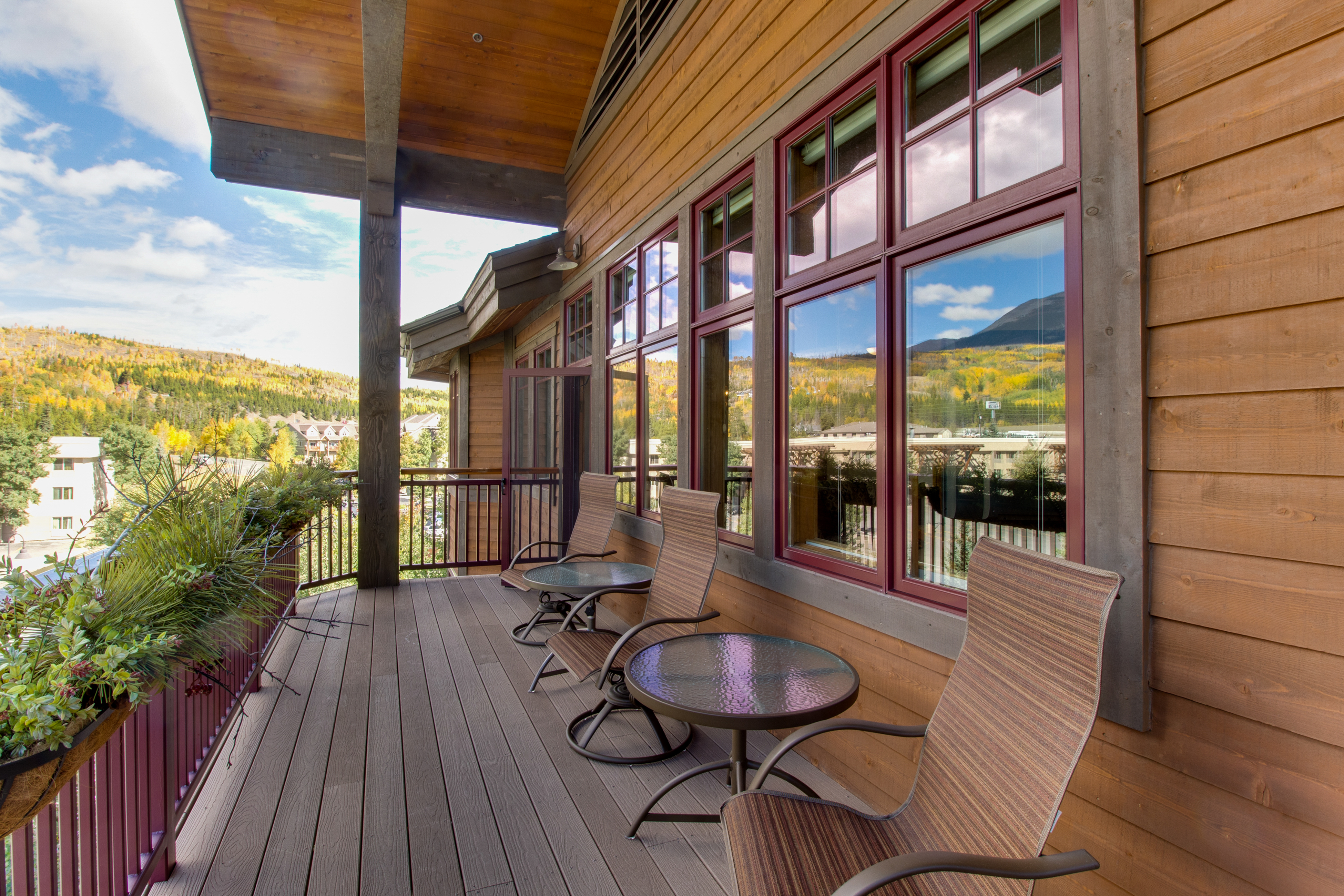 Outdoor tables and chairs on a vacation home deck in Copper Mountain