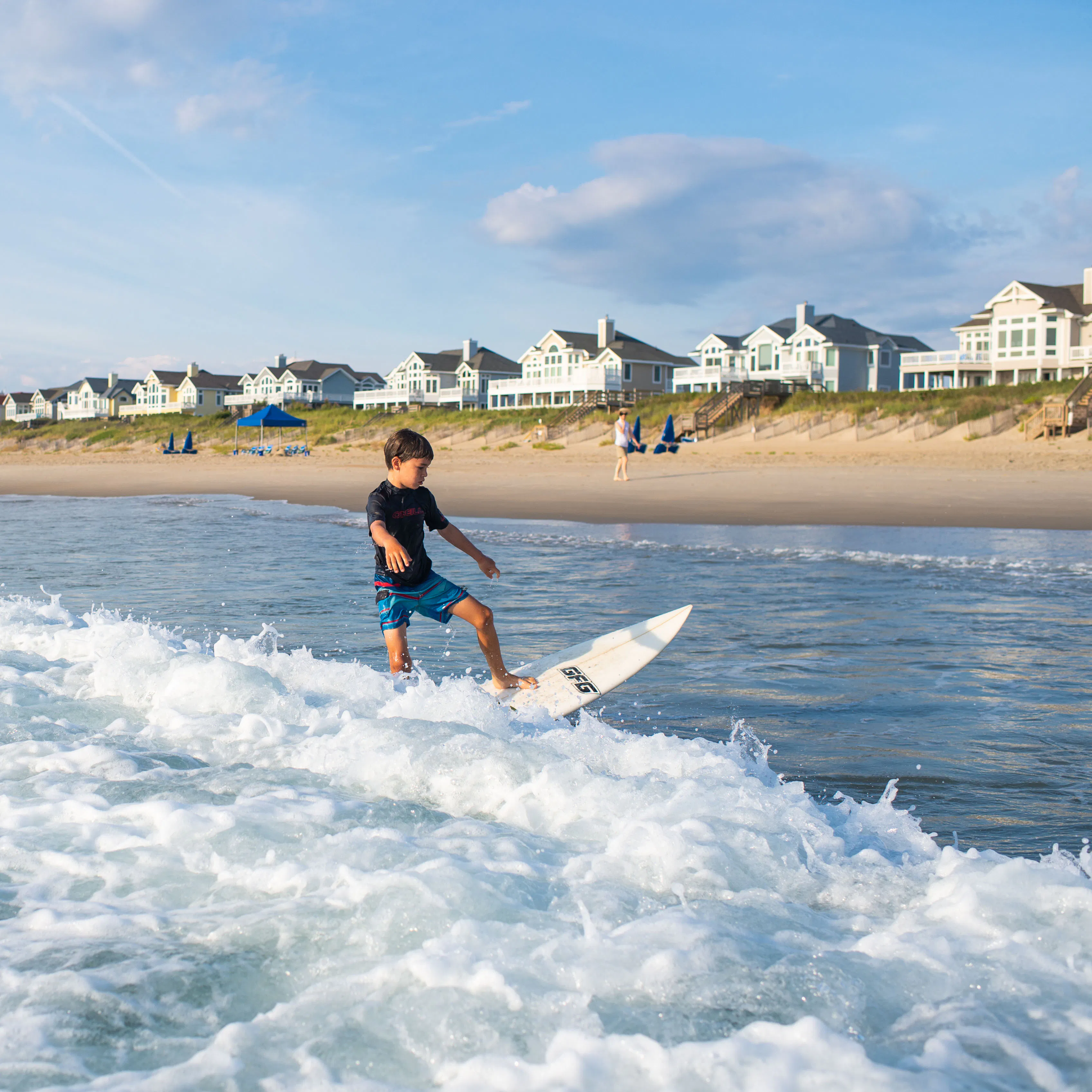 Kid on a surfboard.