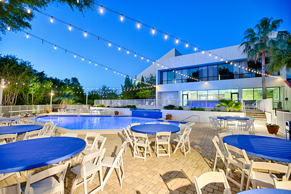 Club Tiki tables set up for a wedding reception at TOPS'L Beach & Racquet Resort