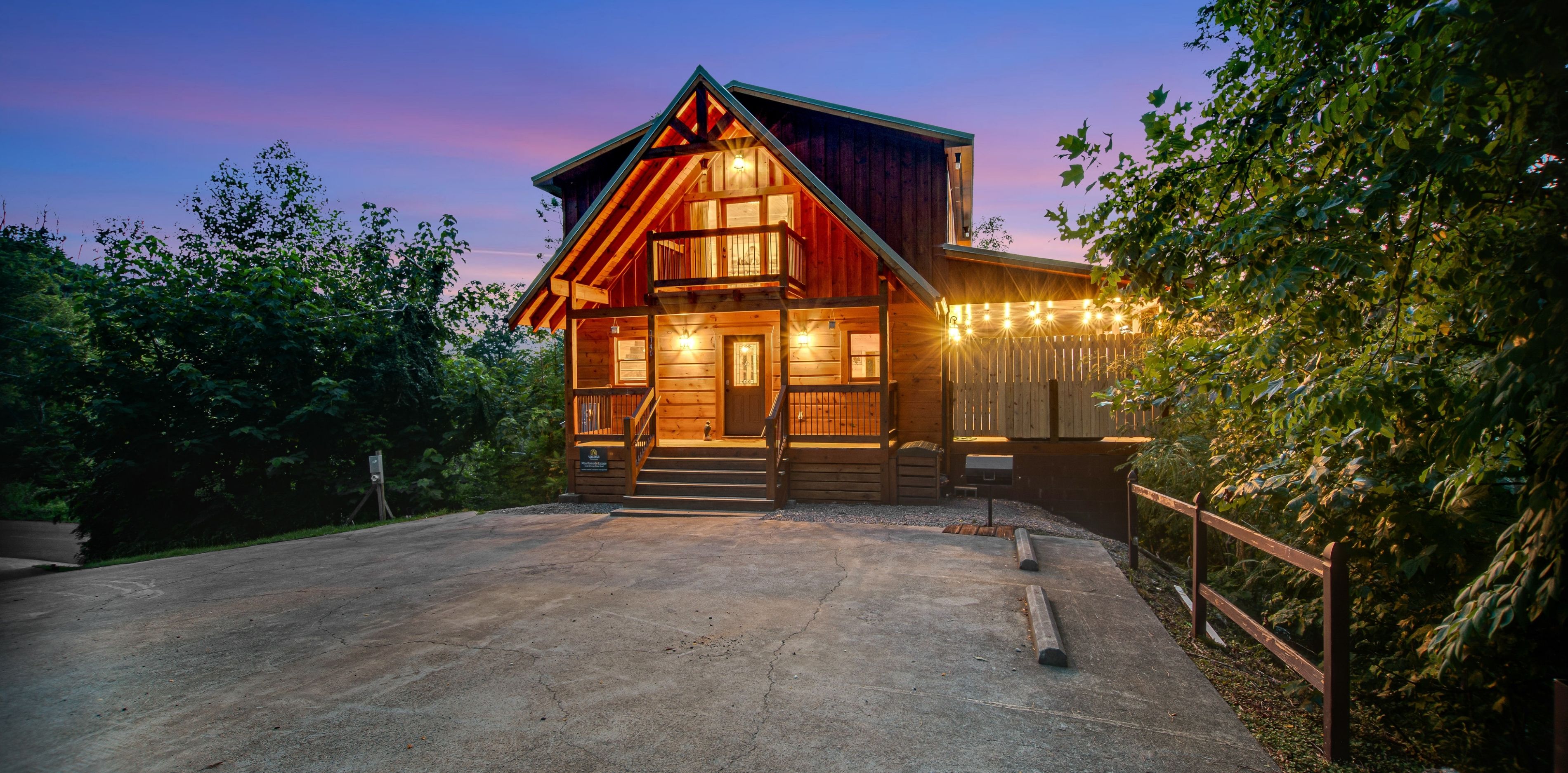 lights twinkle on this cabin in gatlinburg at night