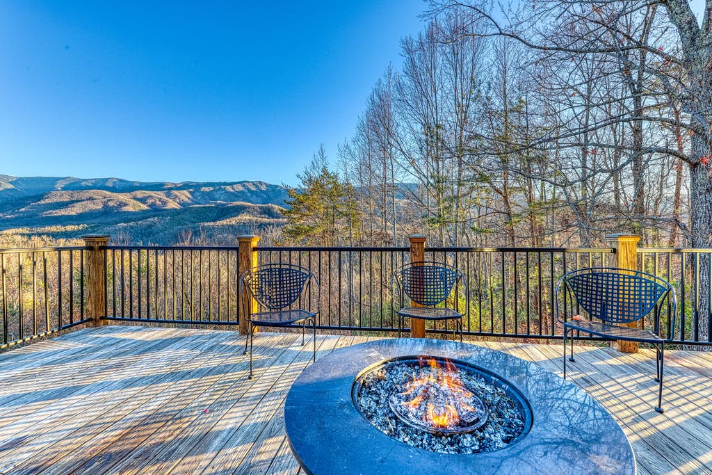 Outdoor fire pit on a vacation home deck in Gatlinburg, TN with mountain views