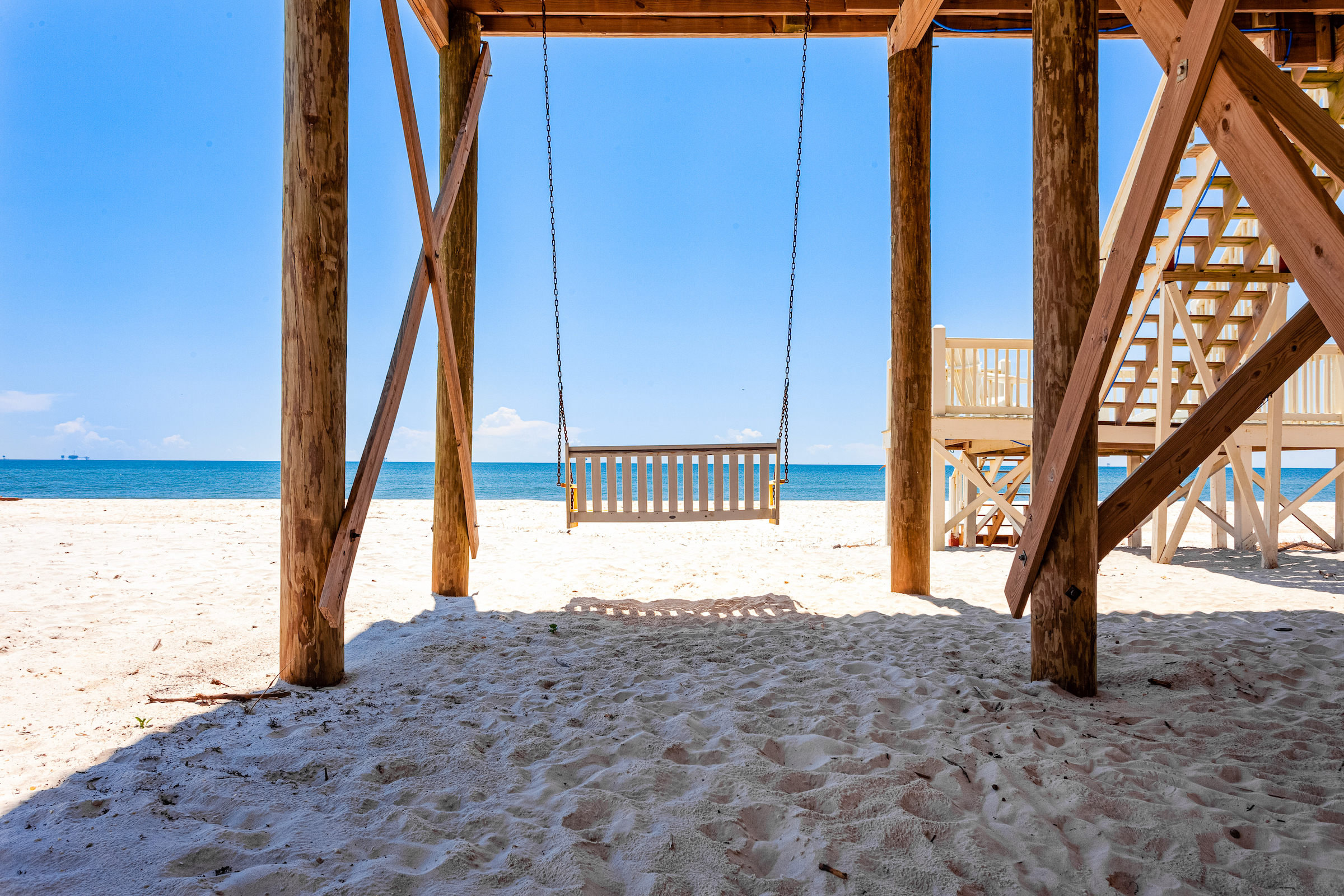 bench swing over beach on the Gulf Coast
