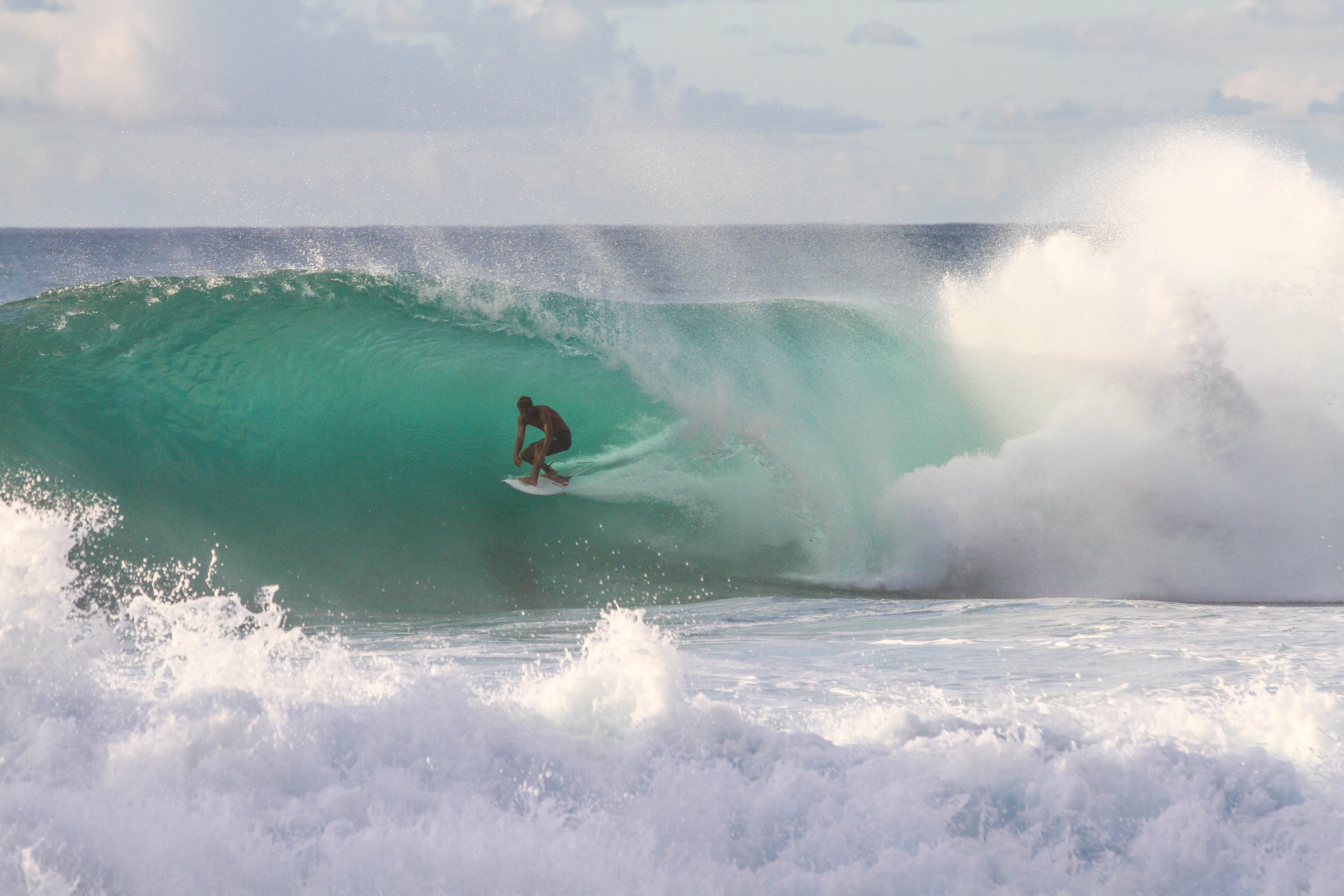 Surfer in Hawaii tube riding