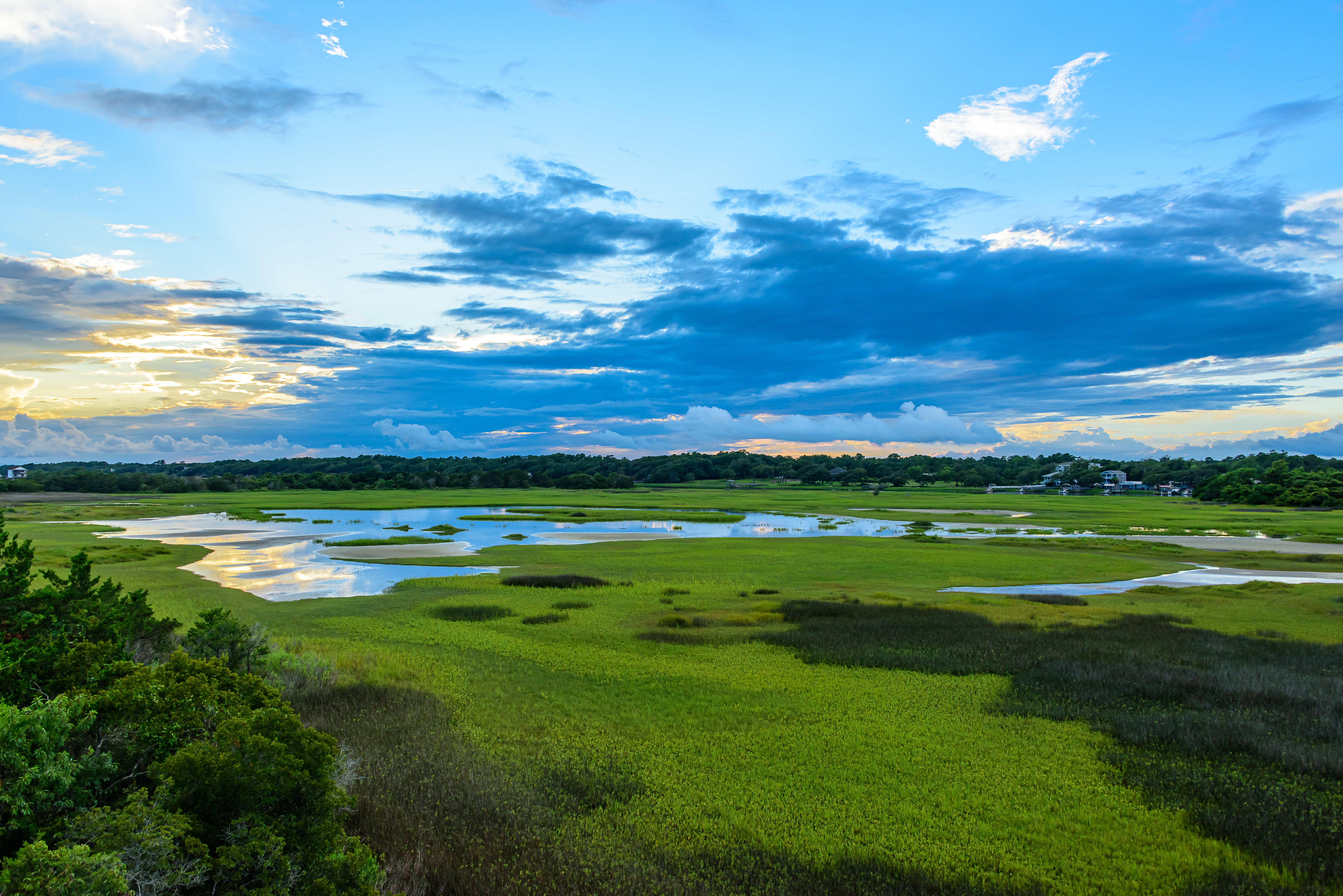 the wetlands of holden beach at sunset