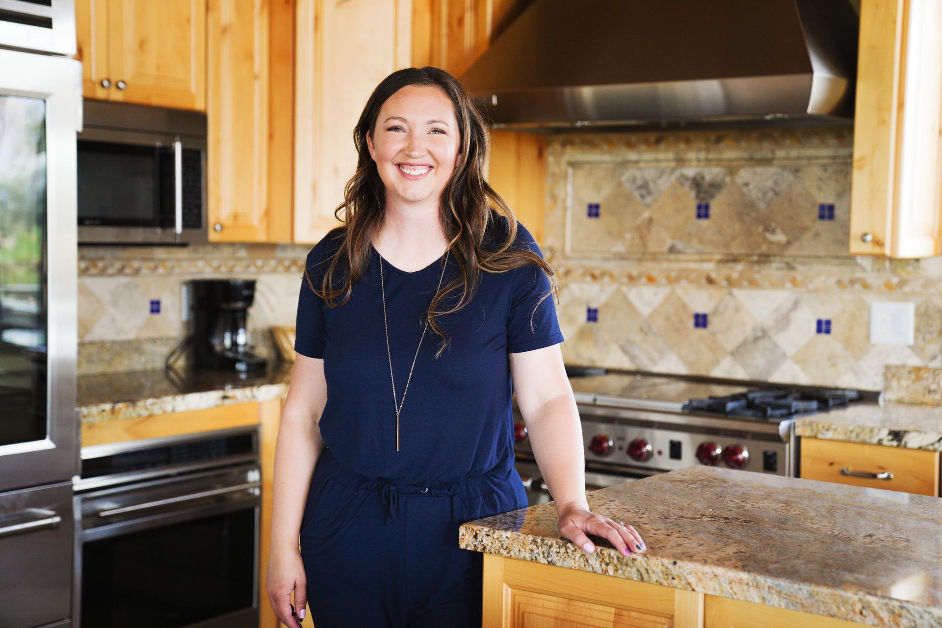 homeowner dottie stands in the kitchen of her vacation home