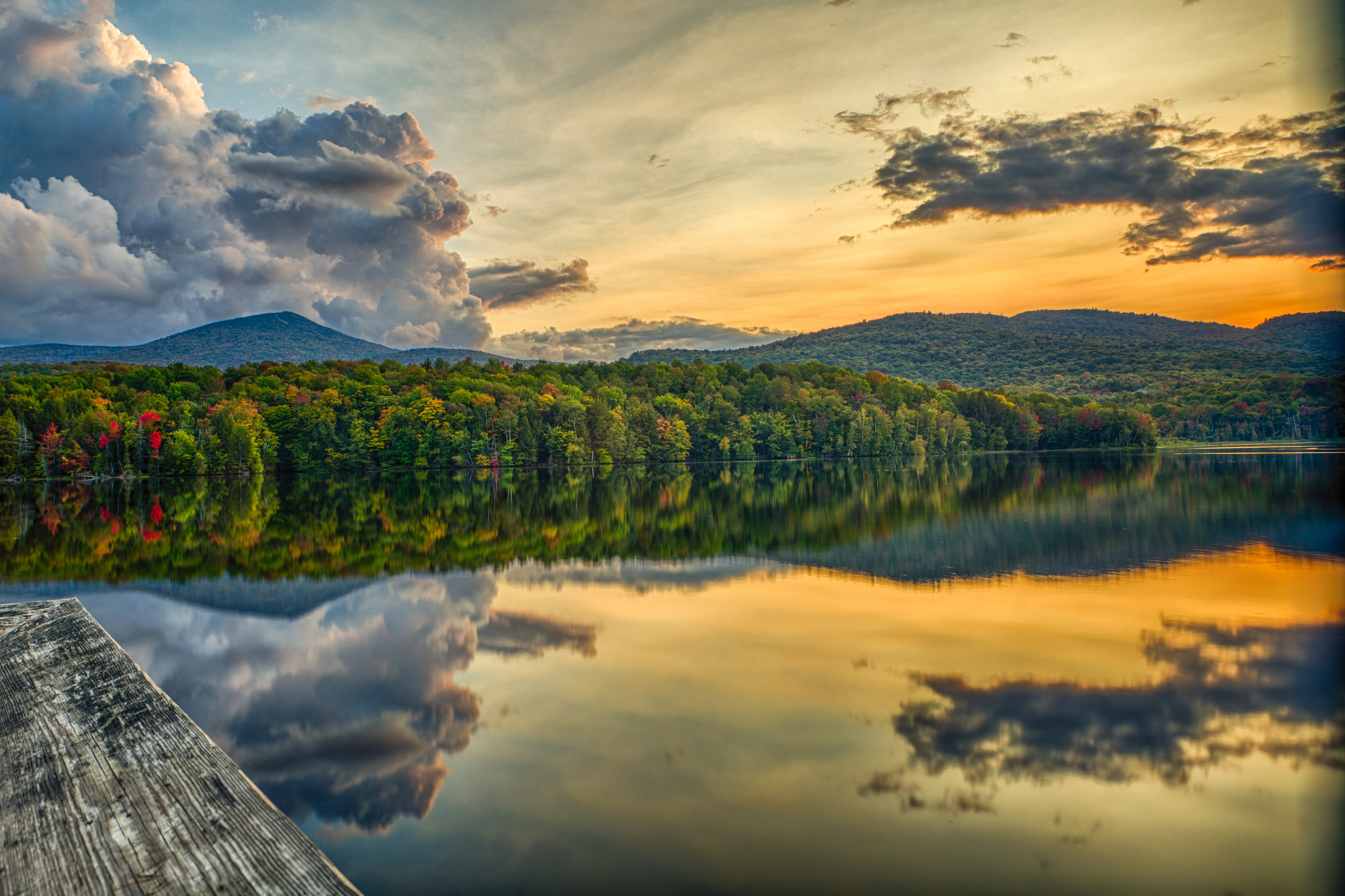 clouds reflect on the surface of a body of water in Killington