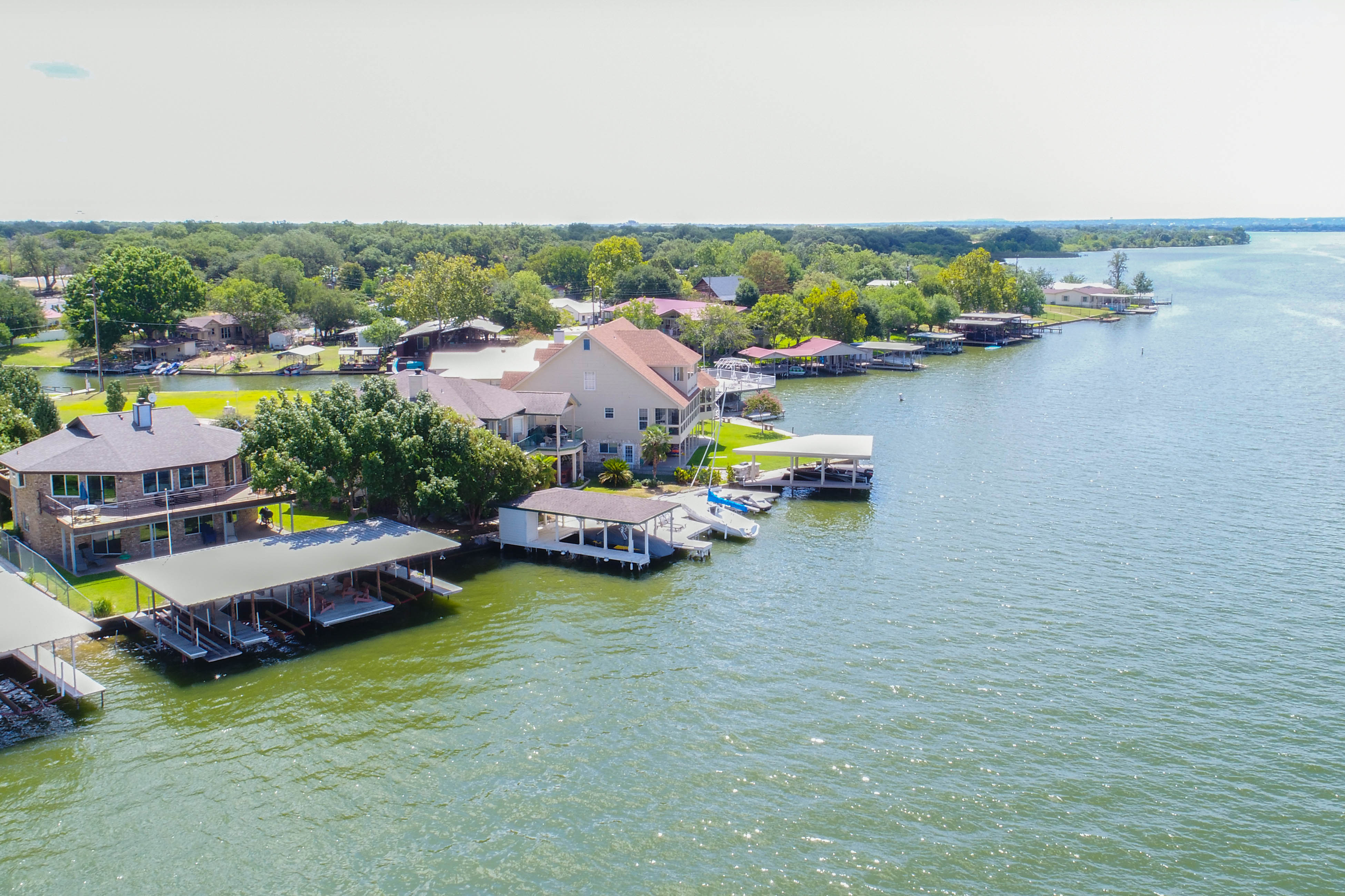 the waters of Lake LBJ glisten in the sunlight