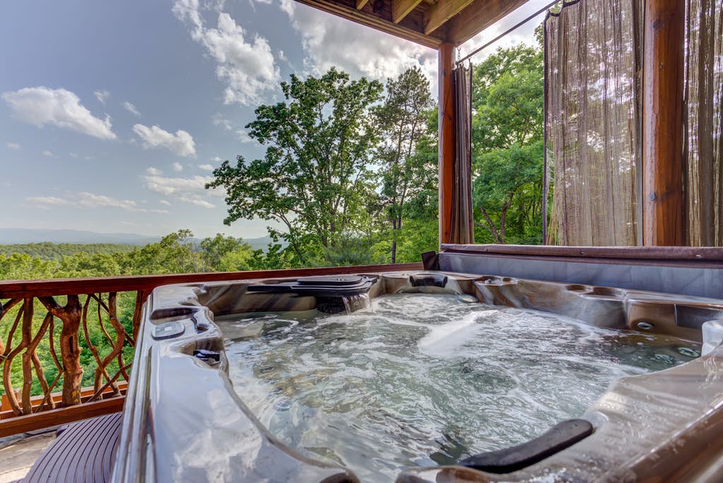Outdoor pool with mountain views on a deck of a vacation home in Mineral Bluff, GA