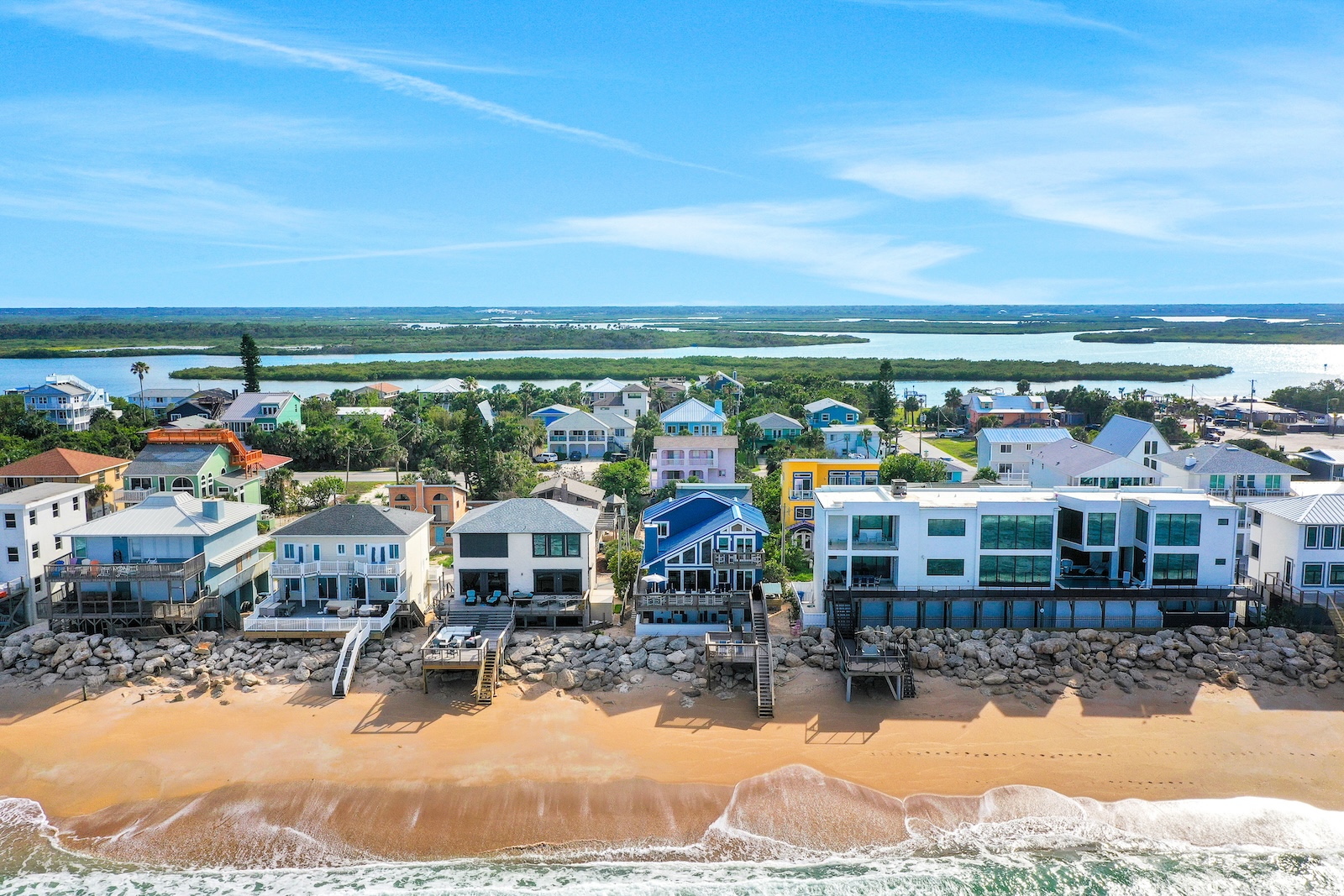 Drone shot of houses along the beach overlooking Mosquito Lagoon.