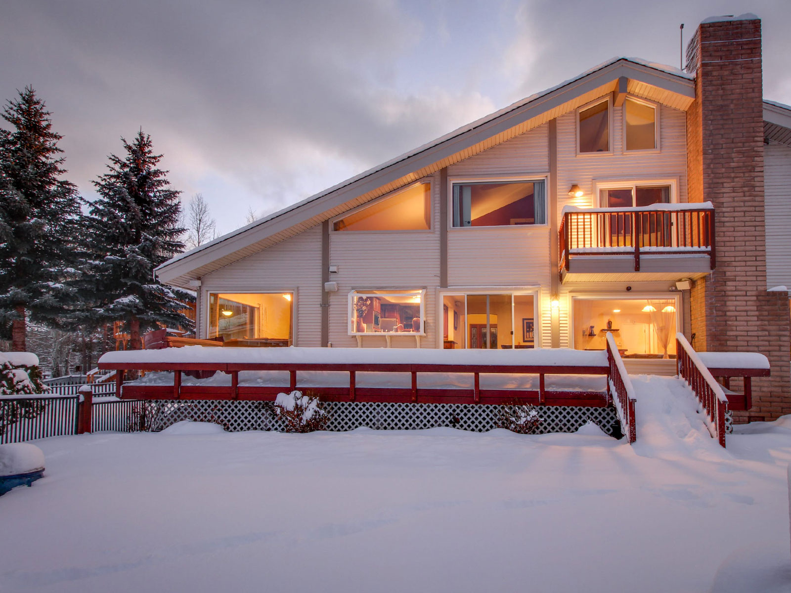 Outside deck on a Lake Tahoe cabin on a snow winter evening
