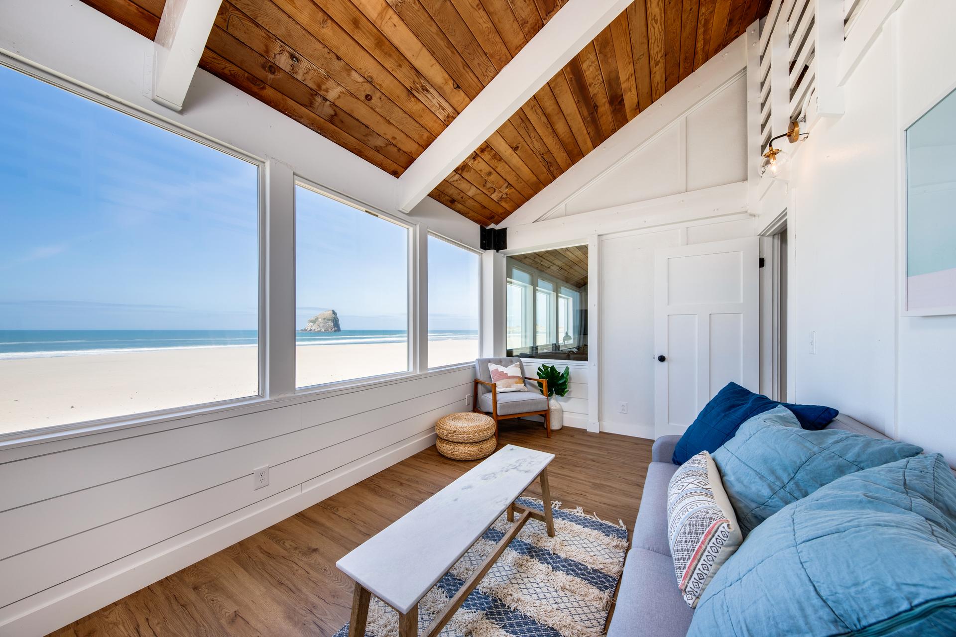 View of Oregon Beach from interior porch of modern coastal home.