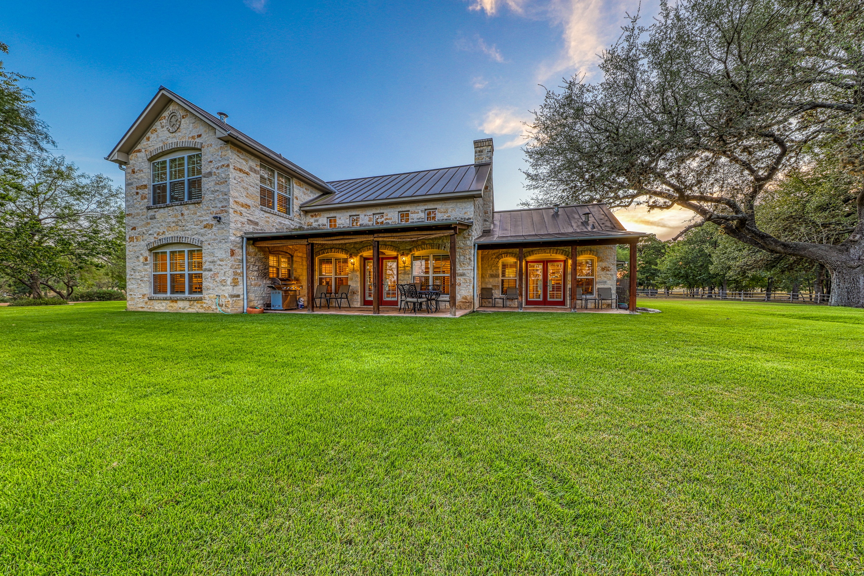 large green lawn of luxury Texas vacation home