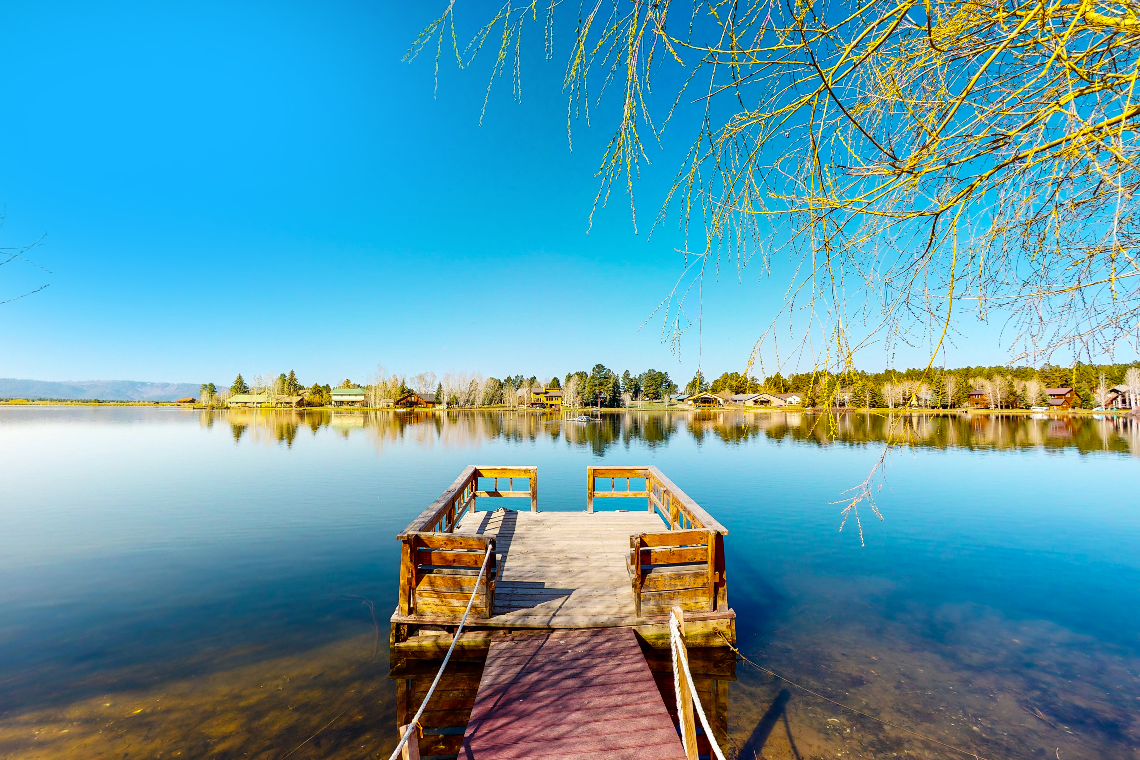 Dock extending into a calm lake