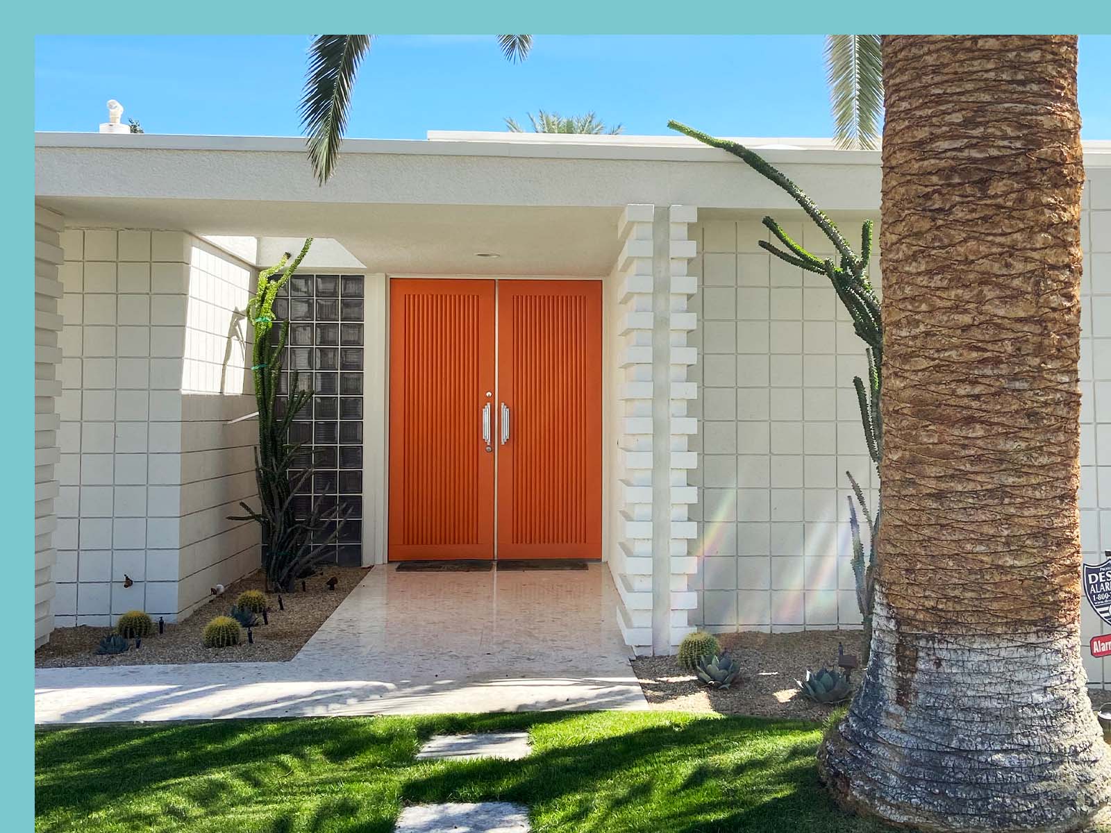 Orange front door of Palm Springs vacation home