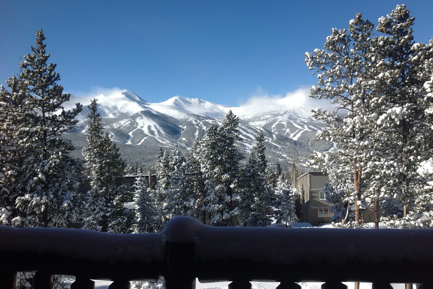 view of snow covered mountains from balcony
