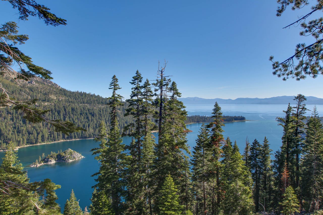 south lake tahoe with blue skies and pine trees