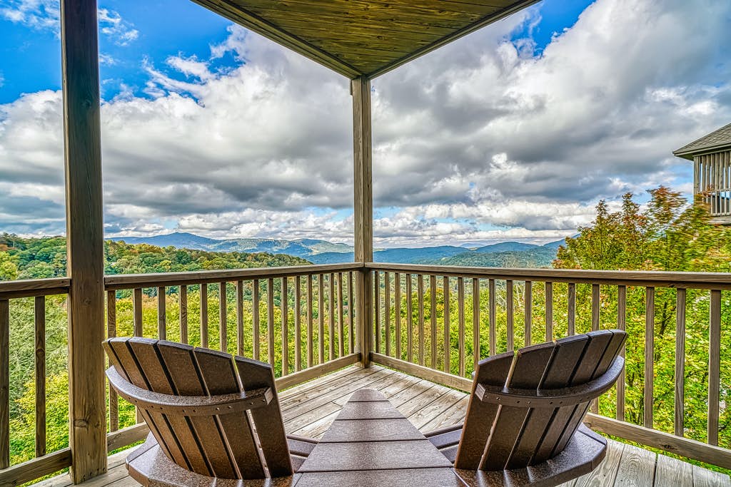 Outdoor deck with a beautiful mountain view on a cloudy blue sky day