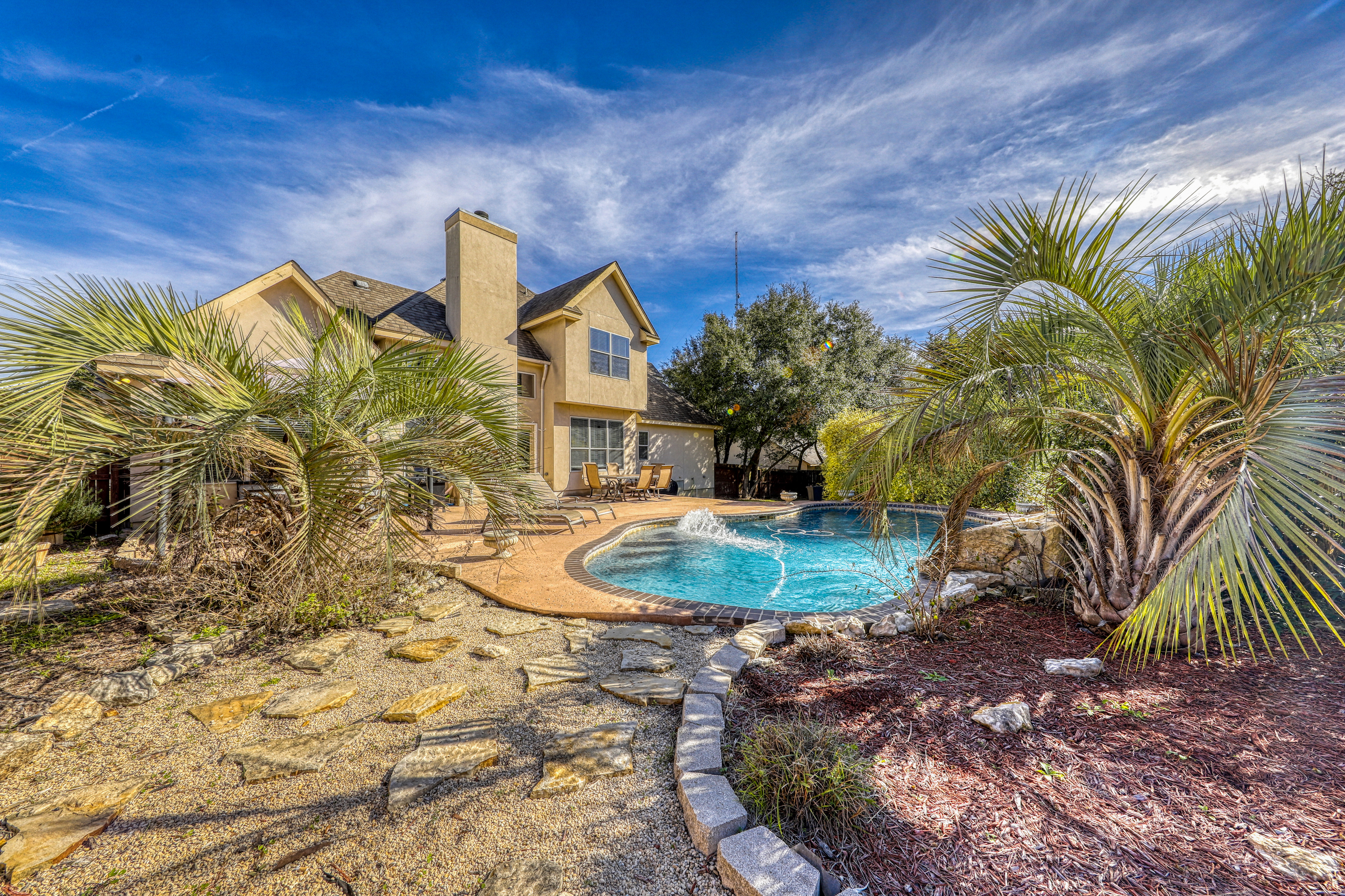 A vacation rental with a pool designed like a desert community in Texas. Hill Country.