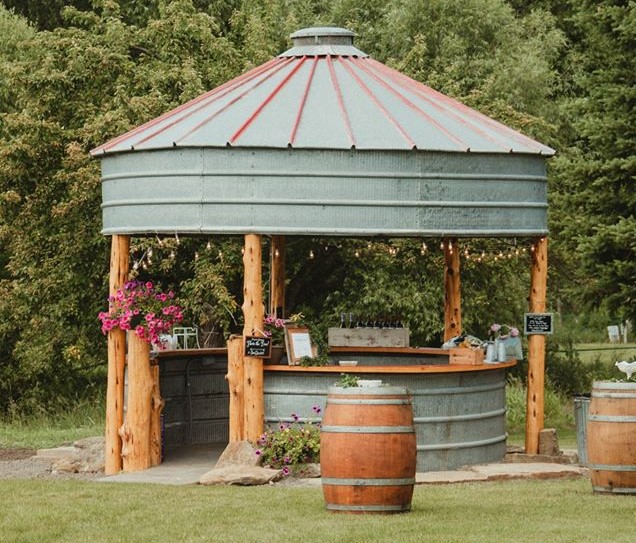 Outdoor tin bar with lights.