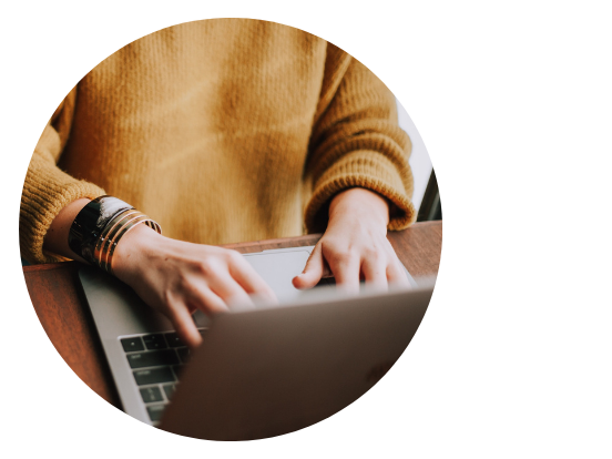 Icon of a person using a laptop.