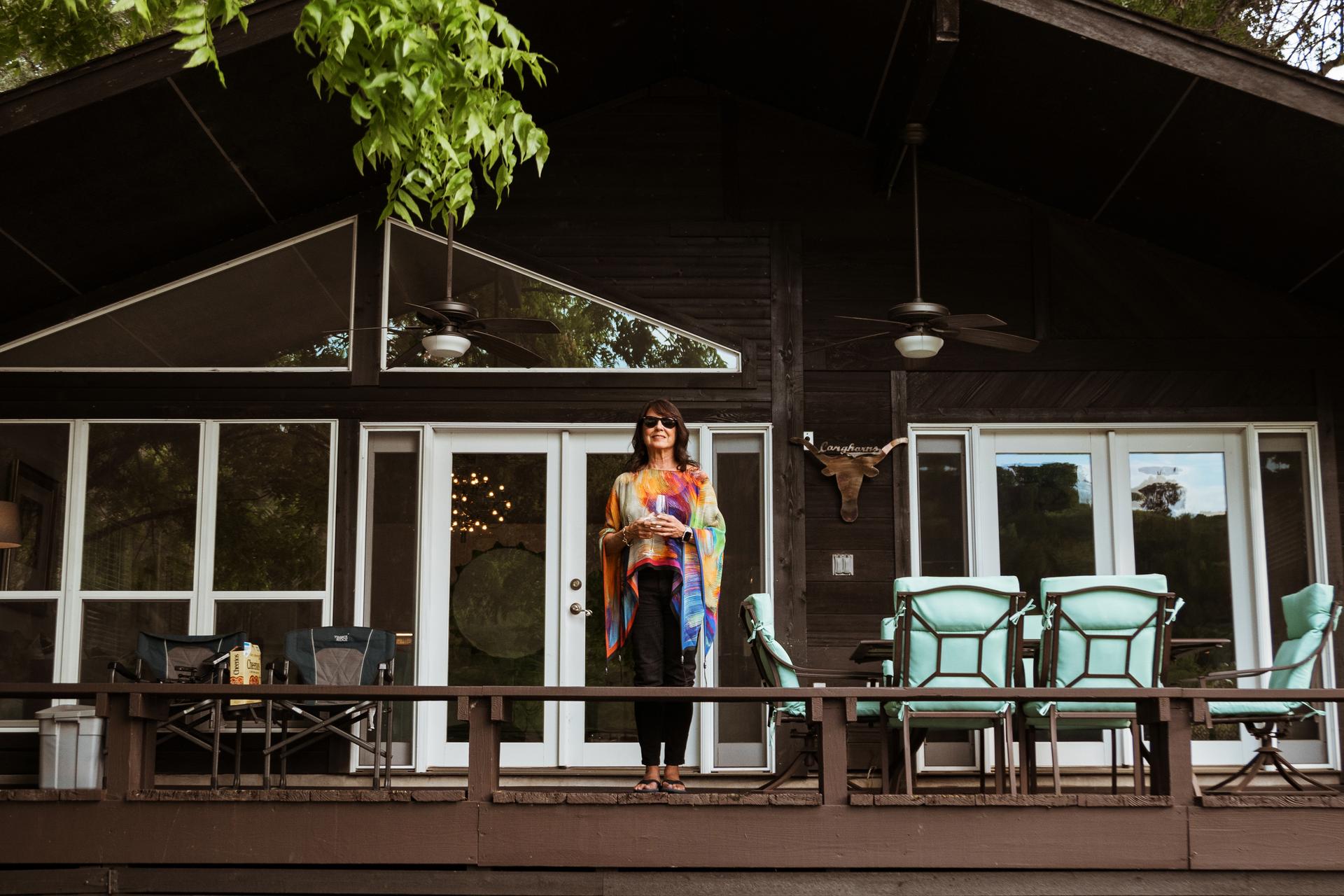 vacasa homeowner diana stands outside her vacation home