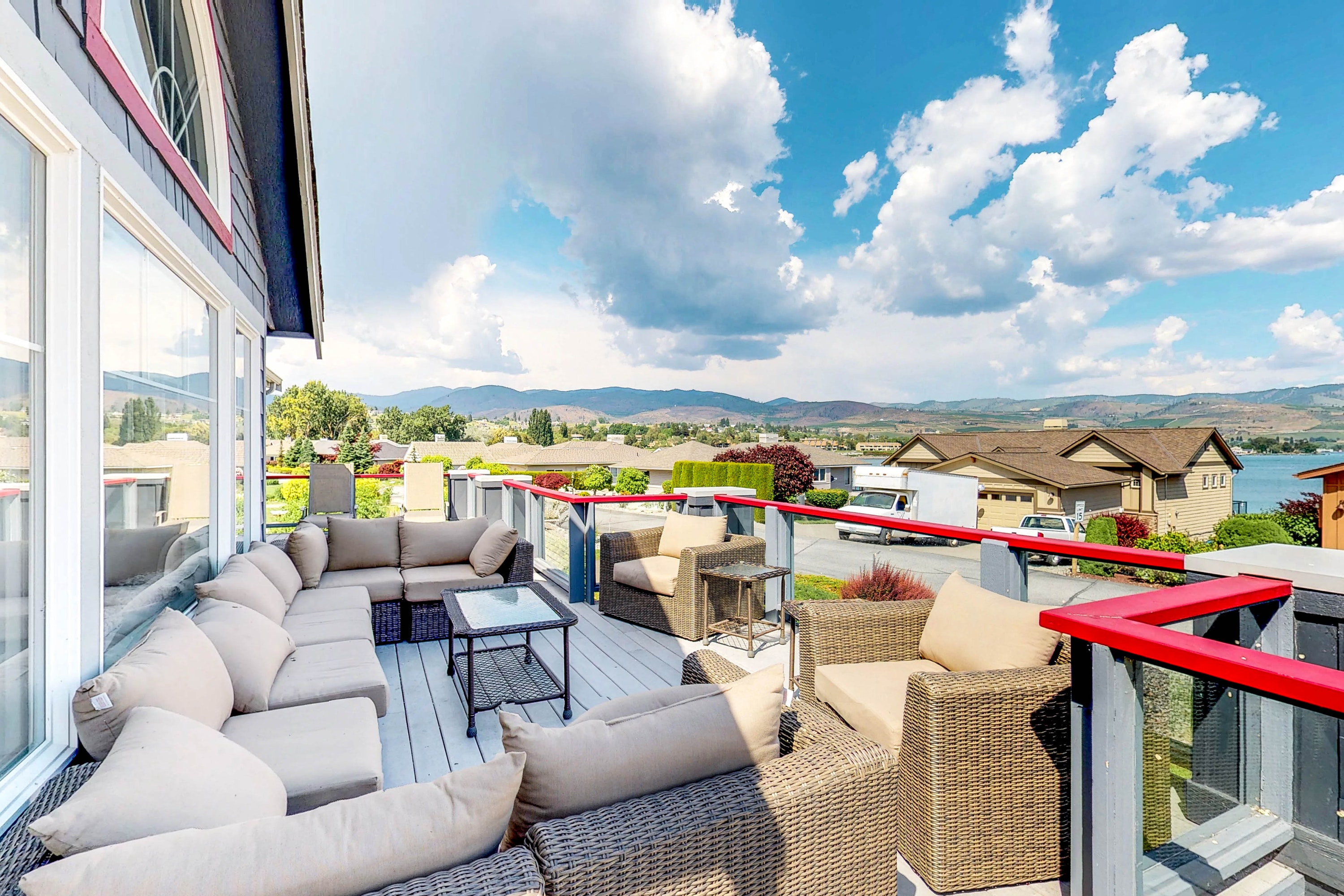 Furnished deck with lake views in Manson, WA