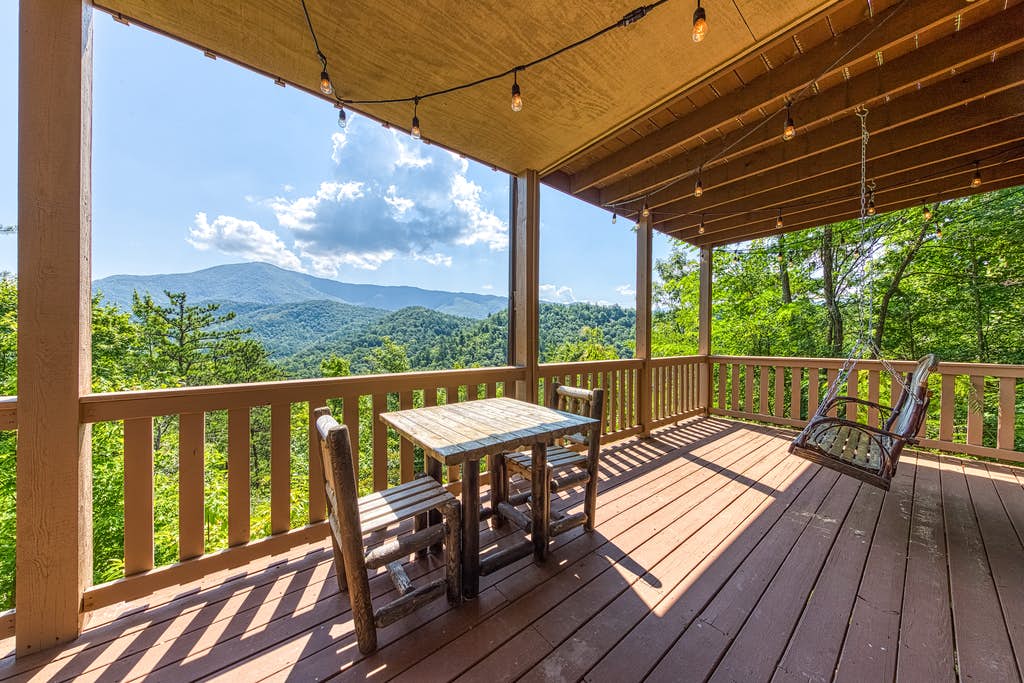 Hanging porch stye chair at a vacation home deck overlooking the mountains in Wears Valley, TN