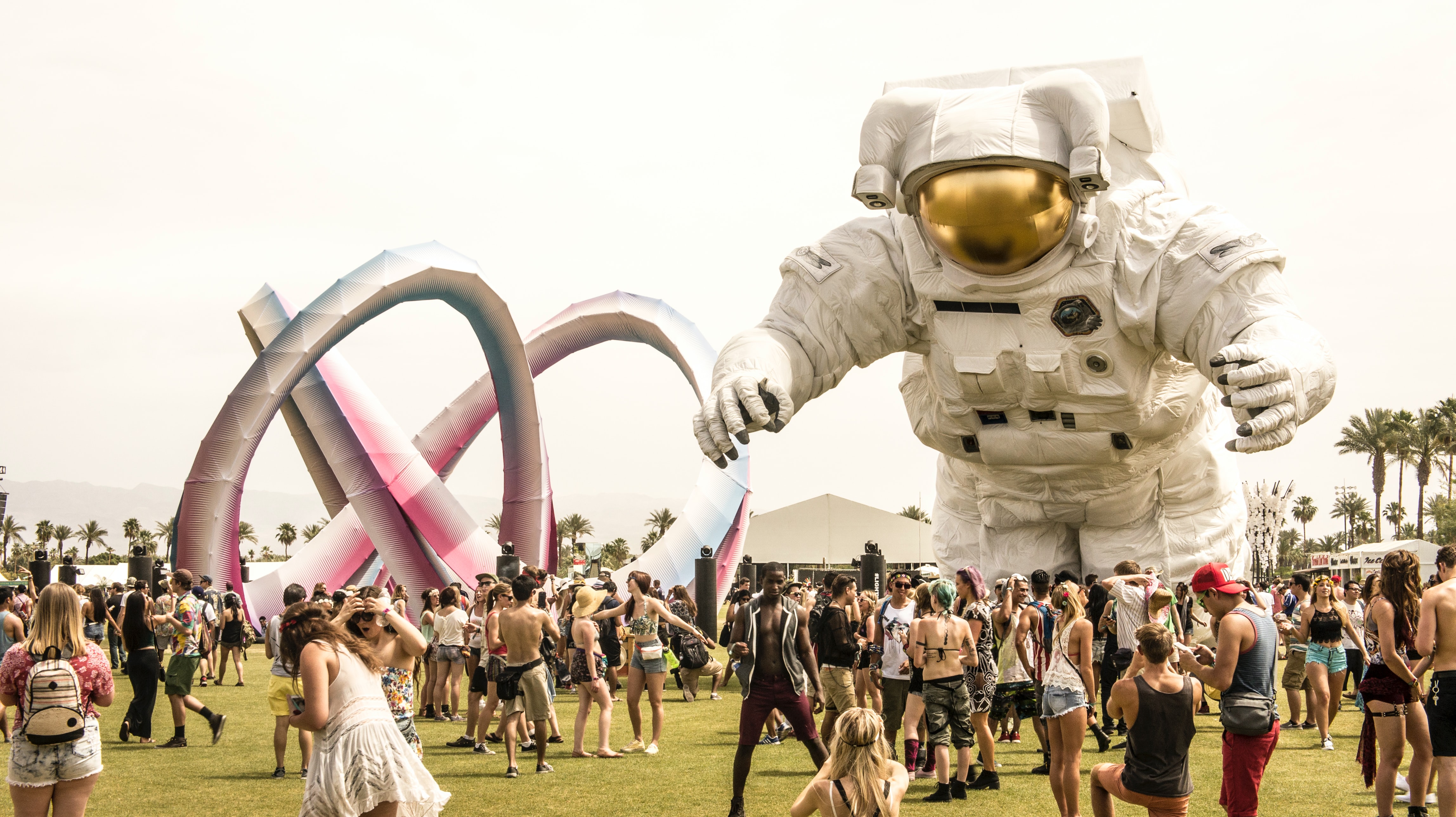 Coachella festival attendees with spaceman.