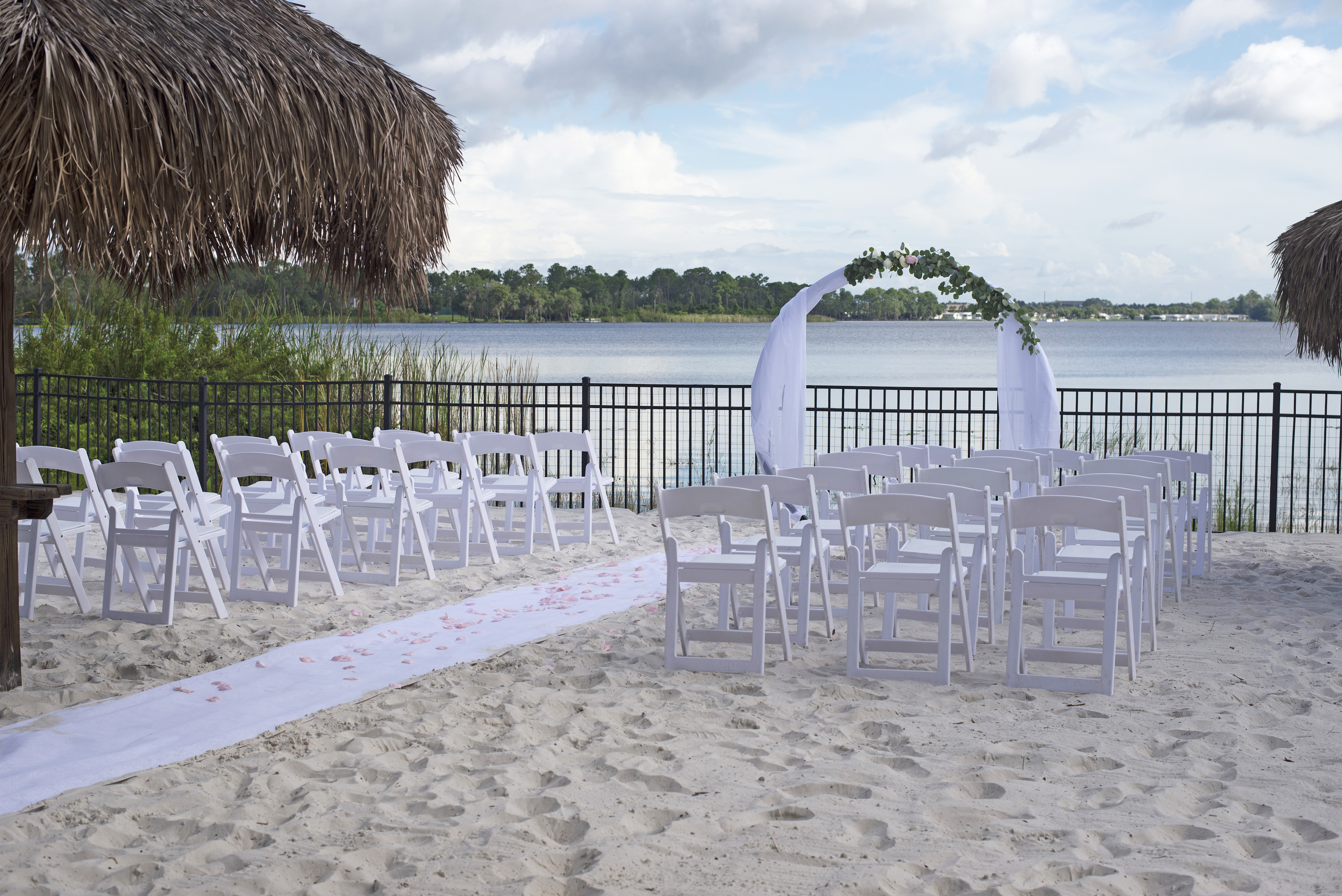 white chairs set up for a beach wedding at Bahama Bay Resort in Orlando