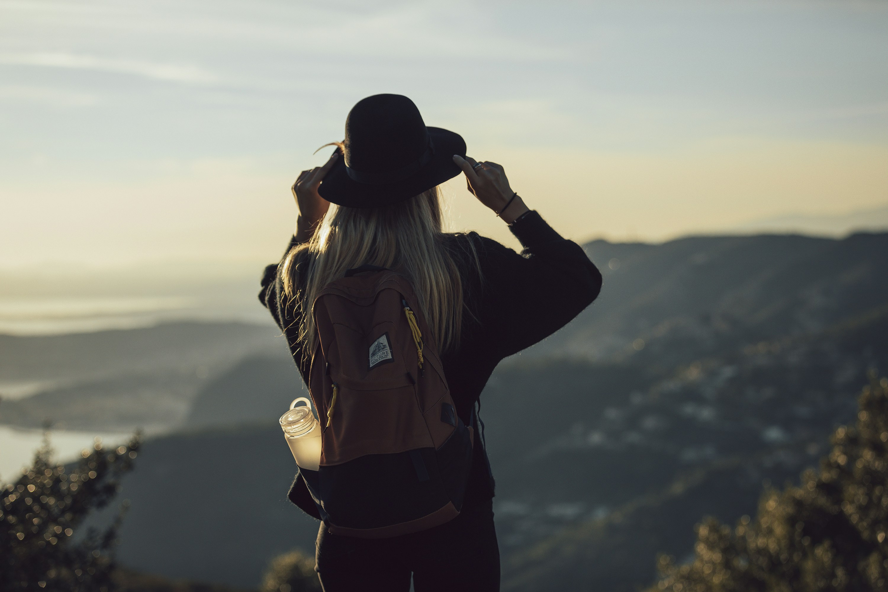 Woman overlooking mountains.