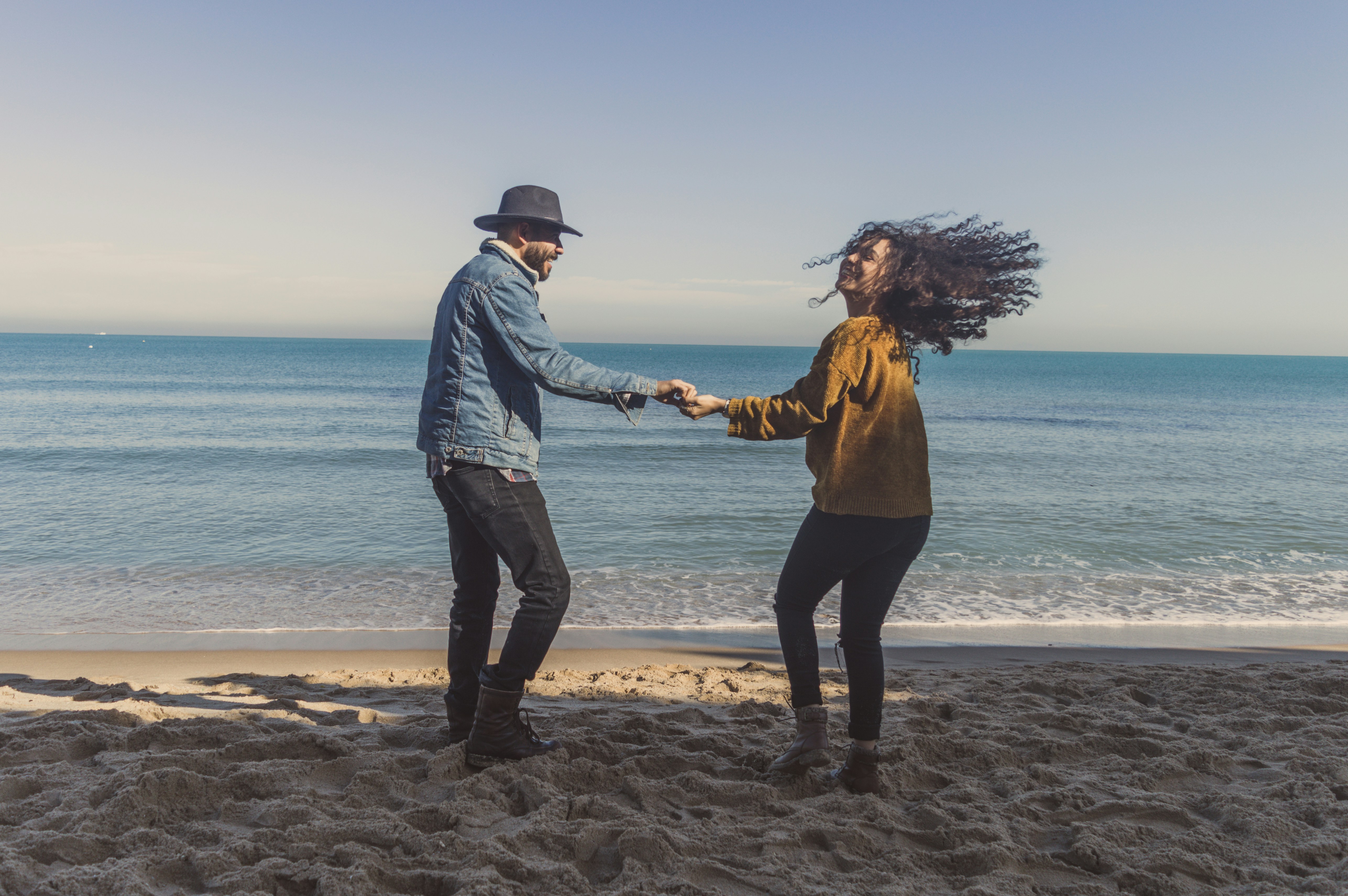 Couple laughing on the beach