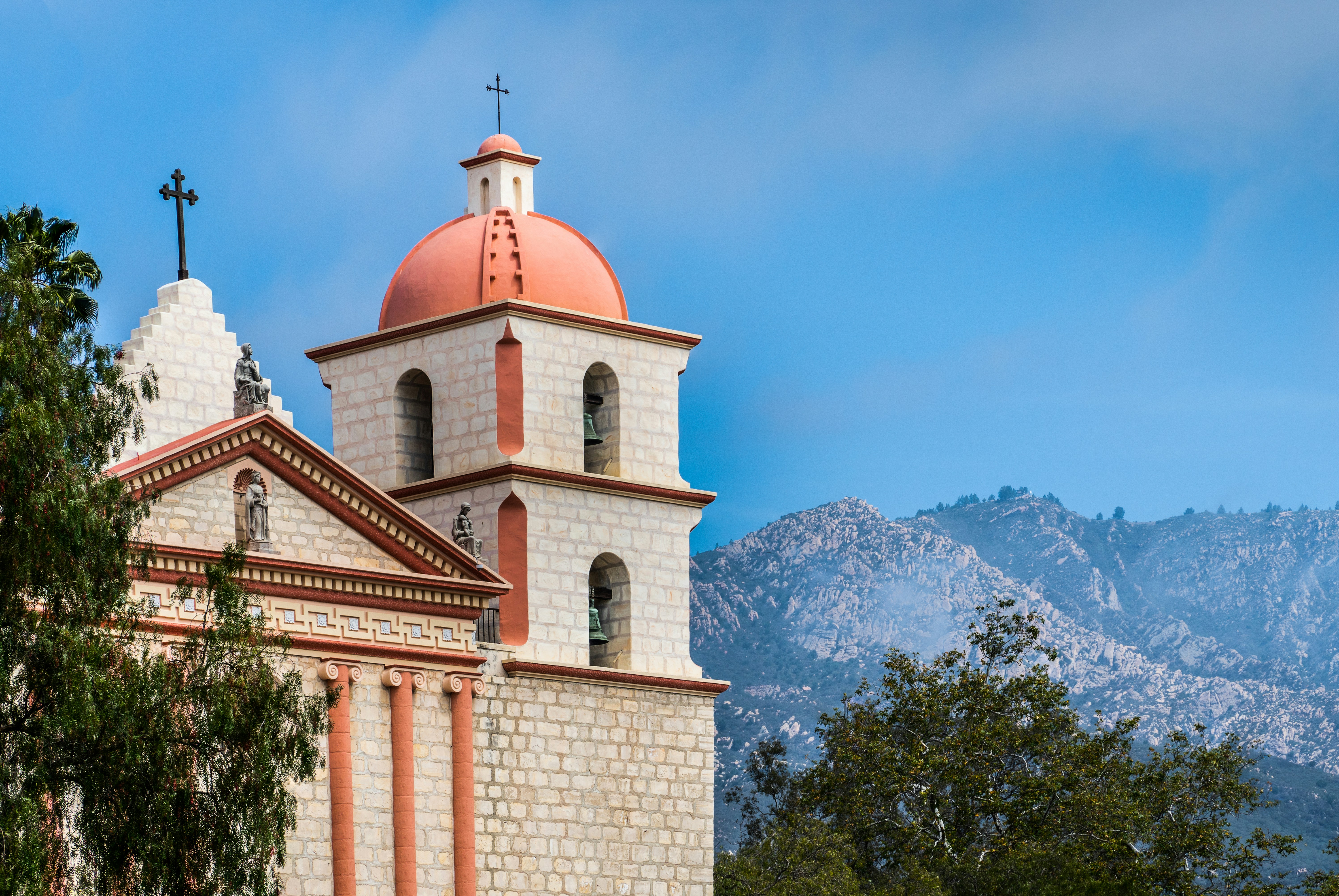 santa barbara mission with mountains in the background