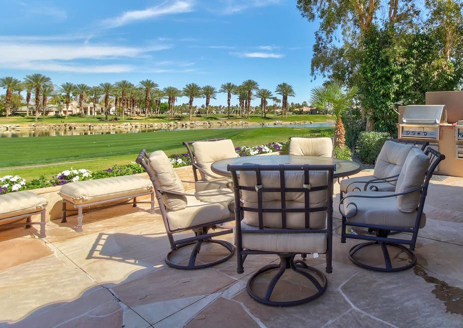 Patio of vacation rental located next to golf course