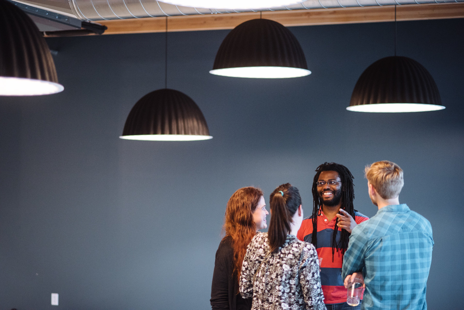 Heartline open house with 4 people chatting