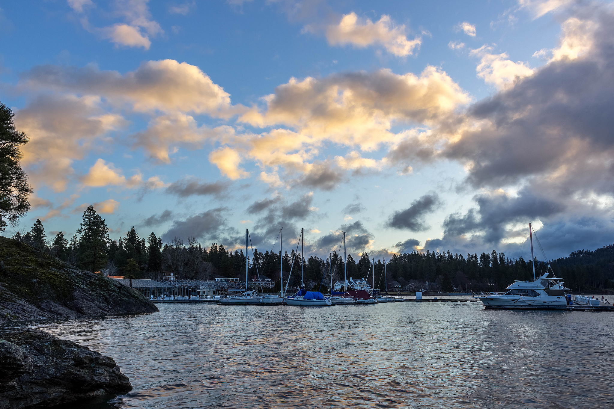 Sail boats docked on a lake